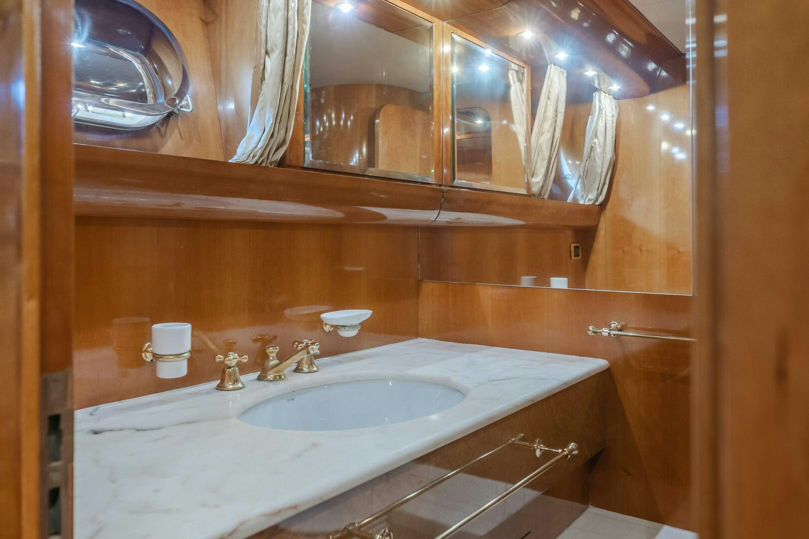 a bathroom with a large mirror aboard C LADY Yacht for Sale
