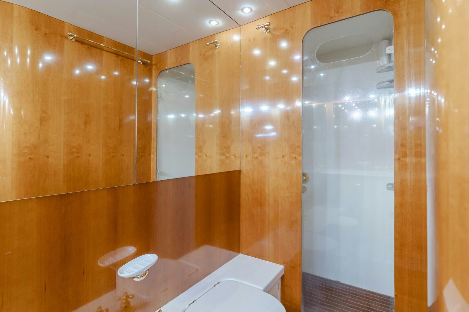 a bathroom with a glass shower aboard C LADY Yacht for Sale