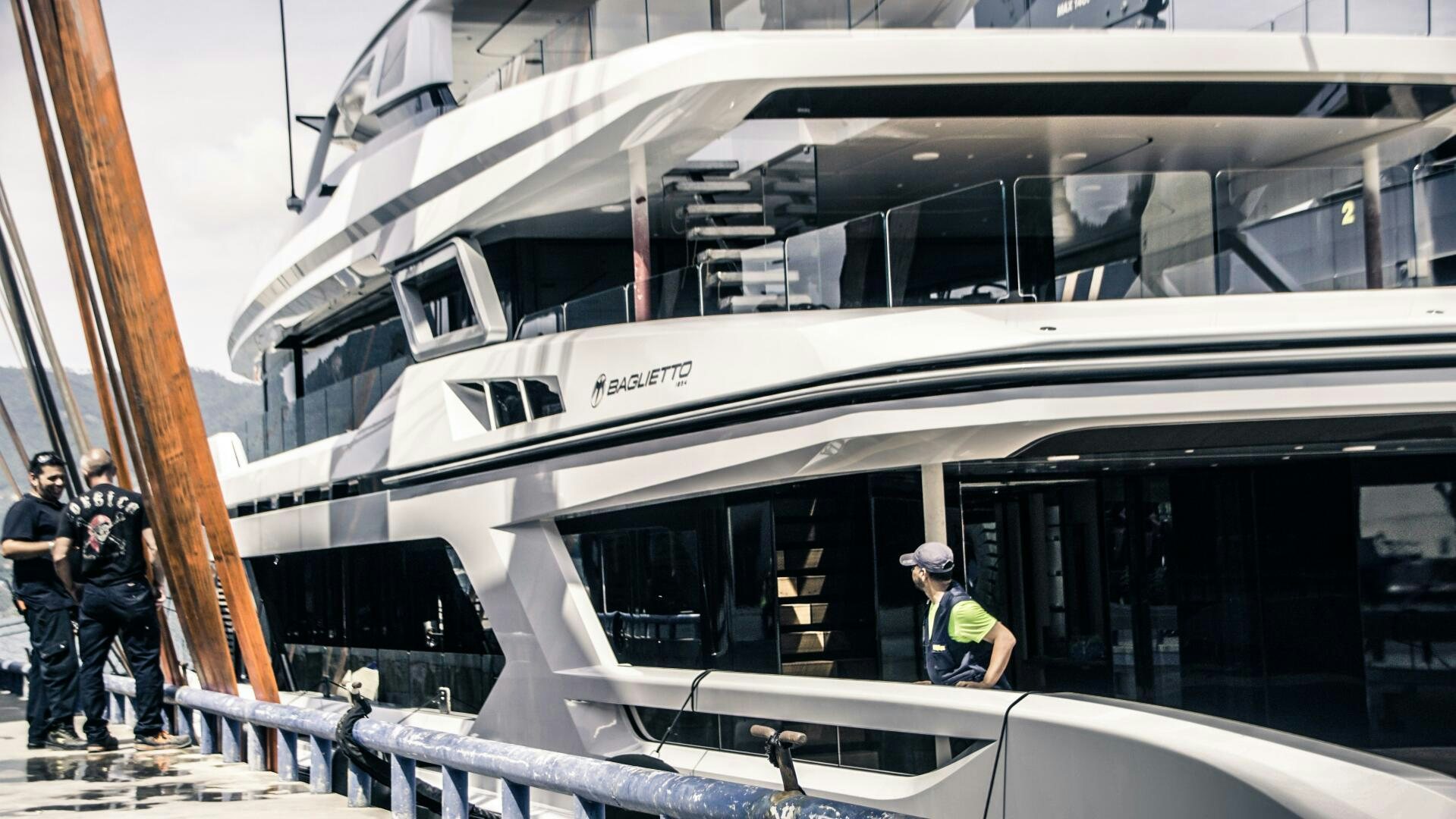 a group of people standing next to a train aboard BAGLIETTO T52 HULL 4 Yacht for Sale