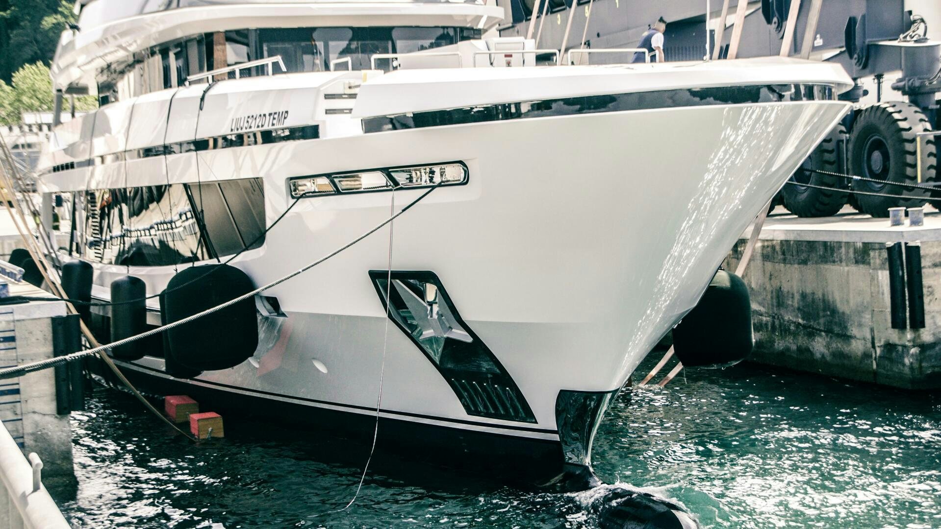 a white yacht docked aboard BAGLIETTO T52 HULL 4 Yacht for Sale