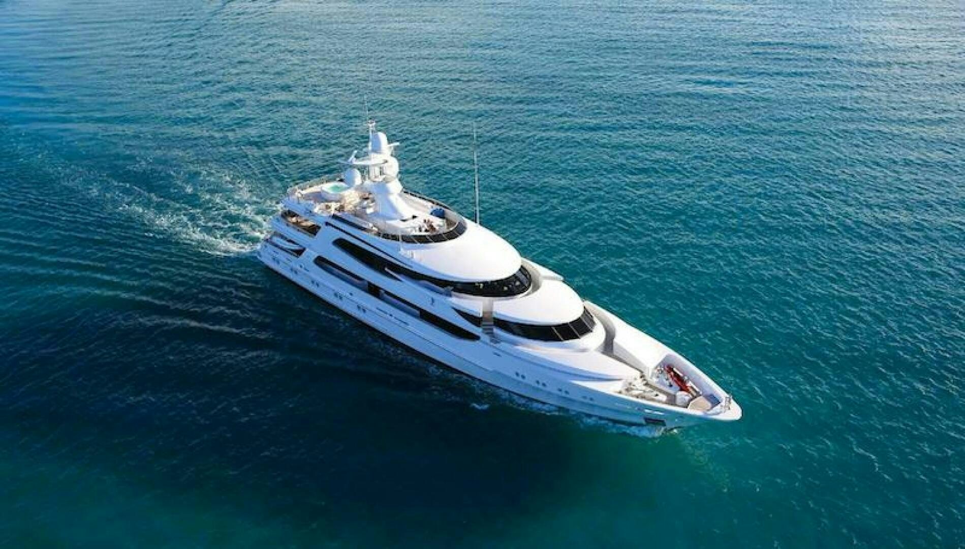 a white boat in the water aboard JOY Yacht for Sale
