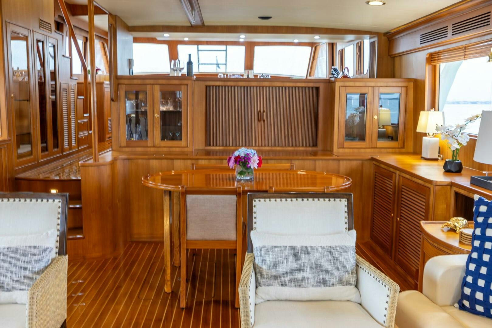 a room with a table and chairs aboard INDIGO Yacht for Sale