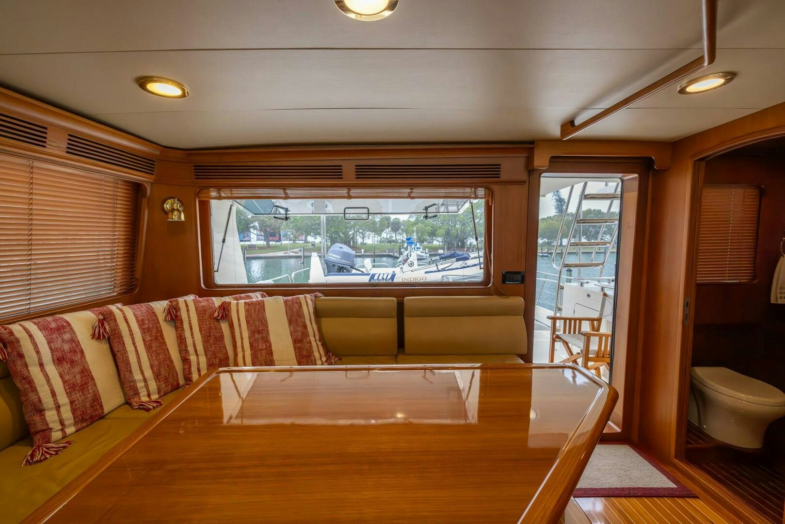 a living room with a large window aboard INDIGO Yacht for Sale