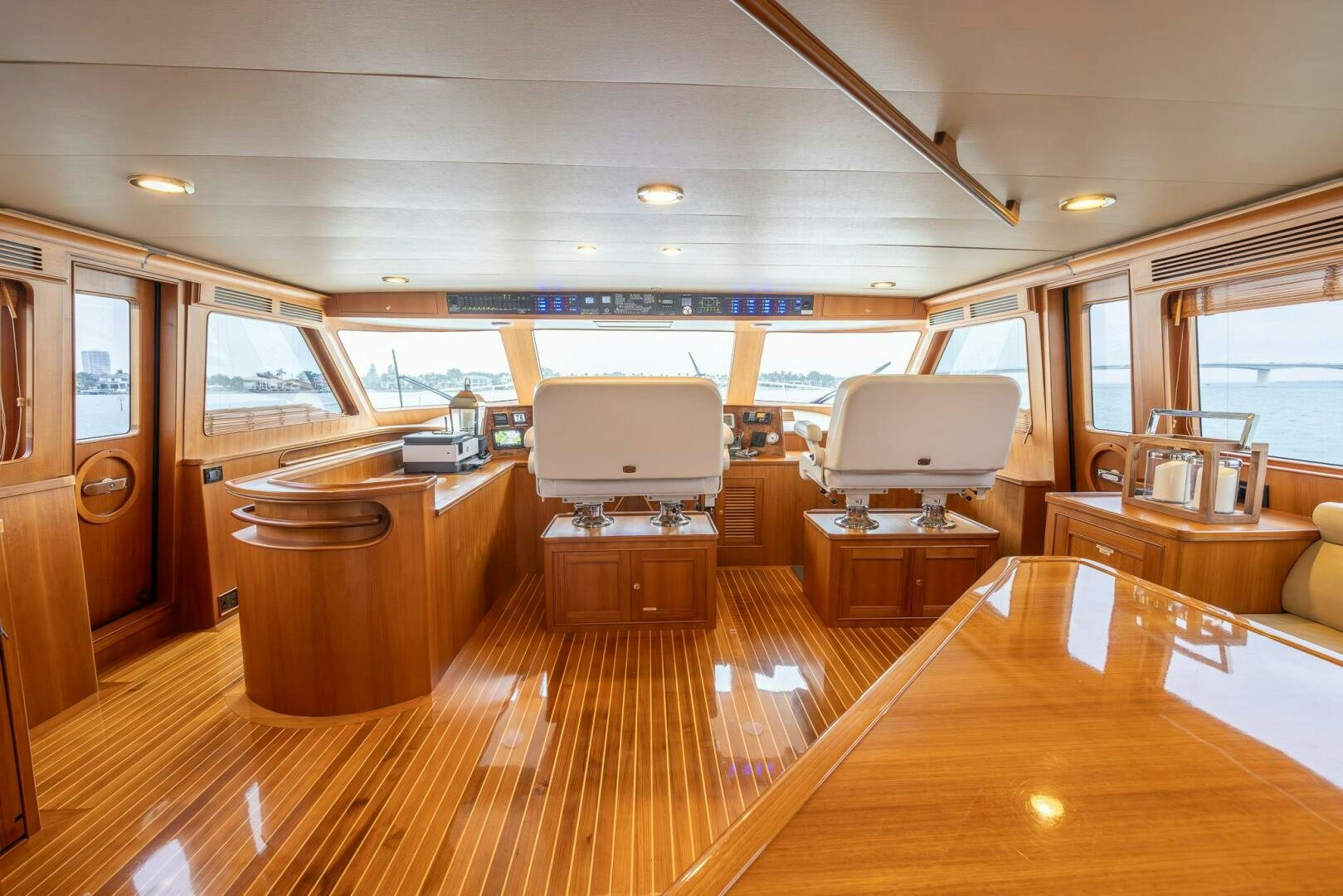 a room with a wood floor and a wood floor and a wood cabinet aboard INDIGO Yacht for Sale