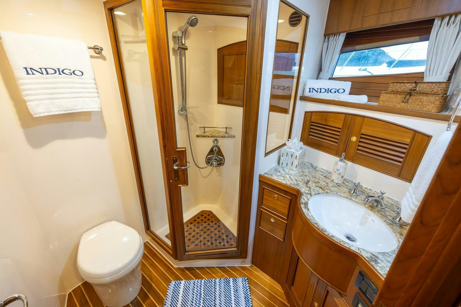 a bathroom with a sink and a toilet aboard INDIGO Yacht for Sale