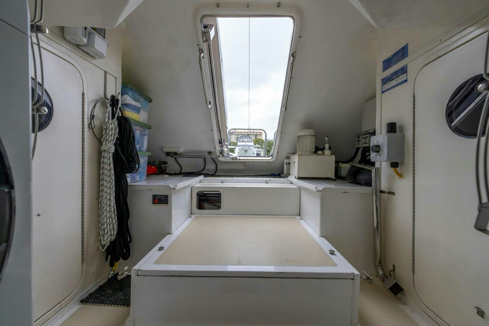 a room with a white table and a window aboard INDIGO Yacht for Sale