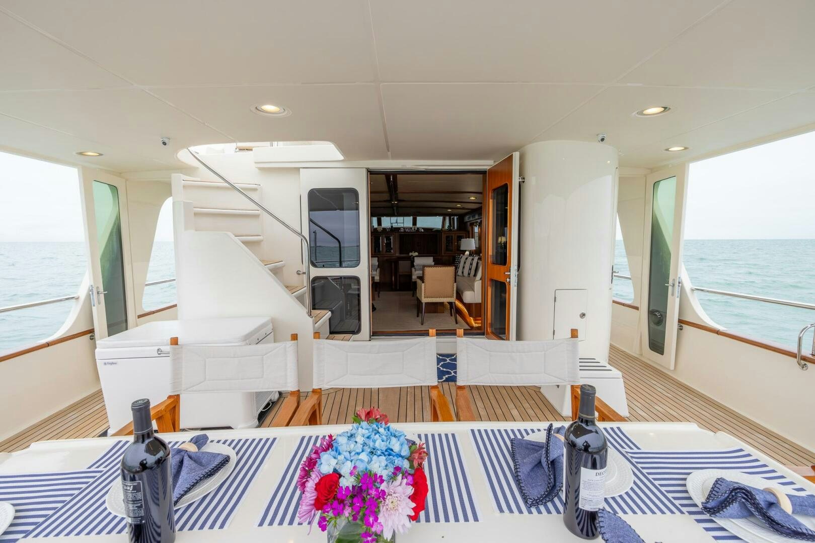 a dining room with a table and chairs aboard INDIGO Yacht for Sale