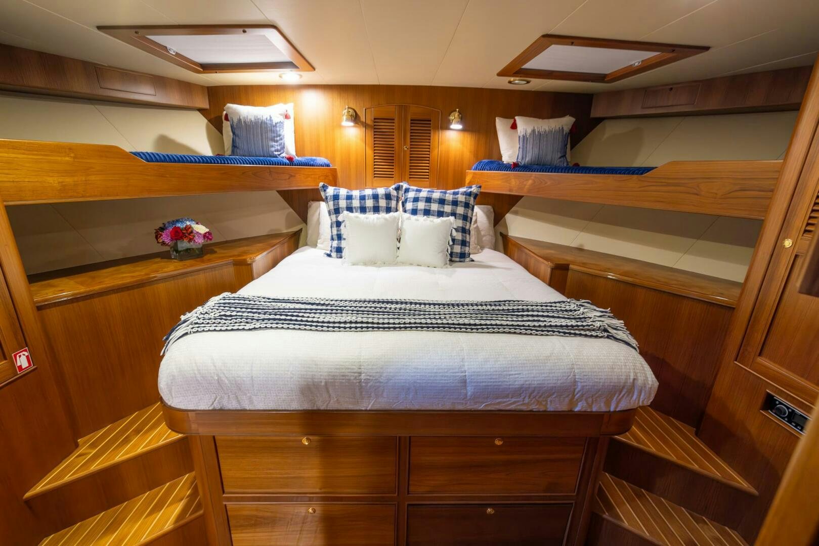 a room with a bed and a desk aboard INDIGO Yacht for Sale