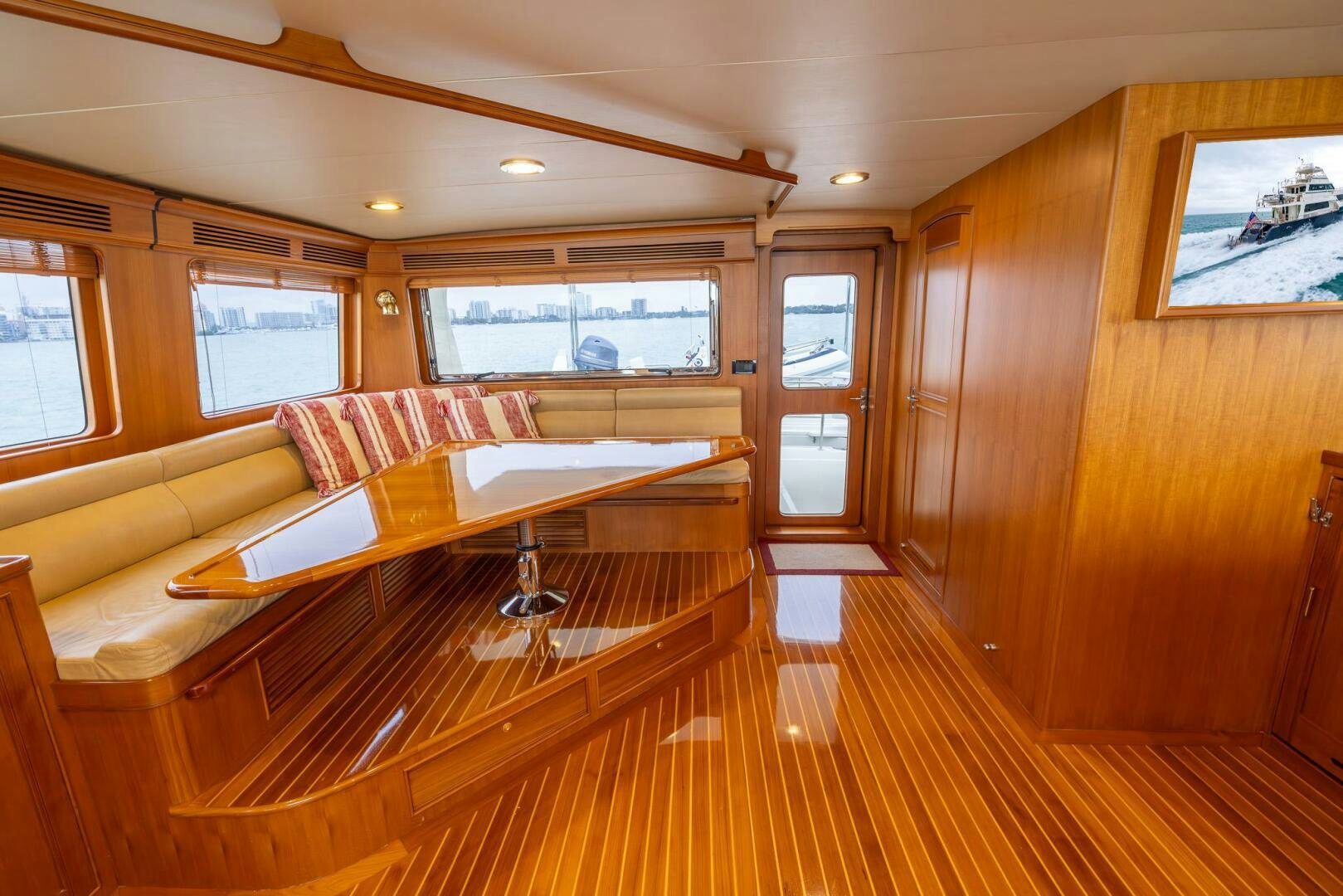 a room with a couch and a table aboard INDIGO Yacht for Sale