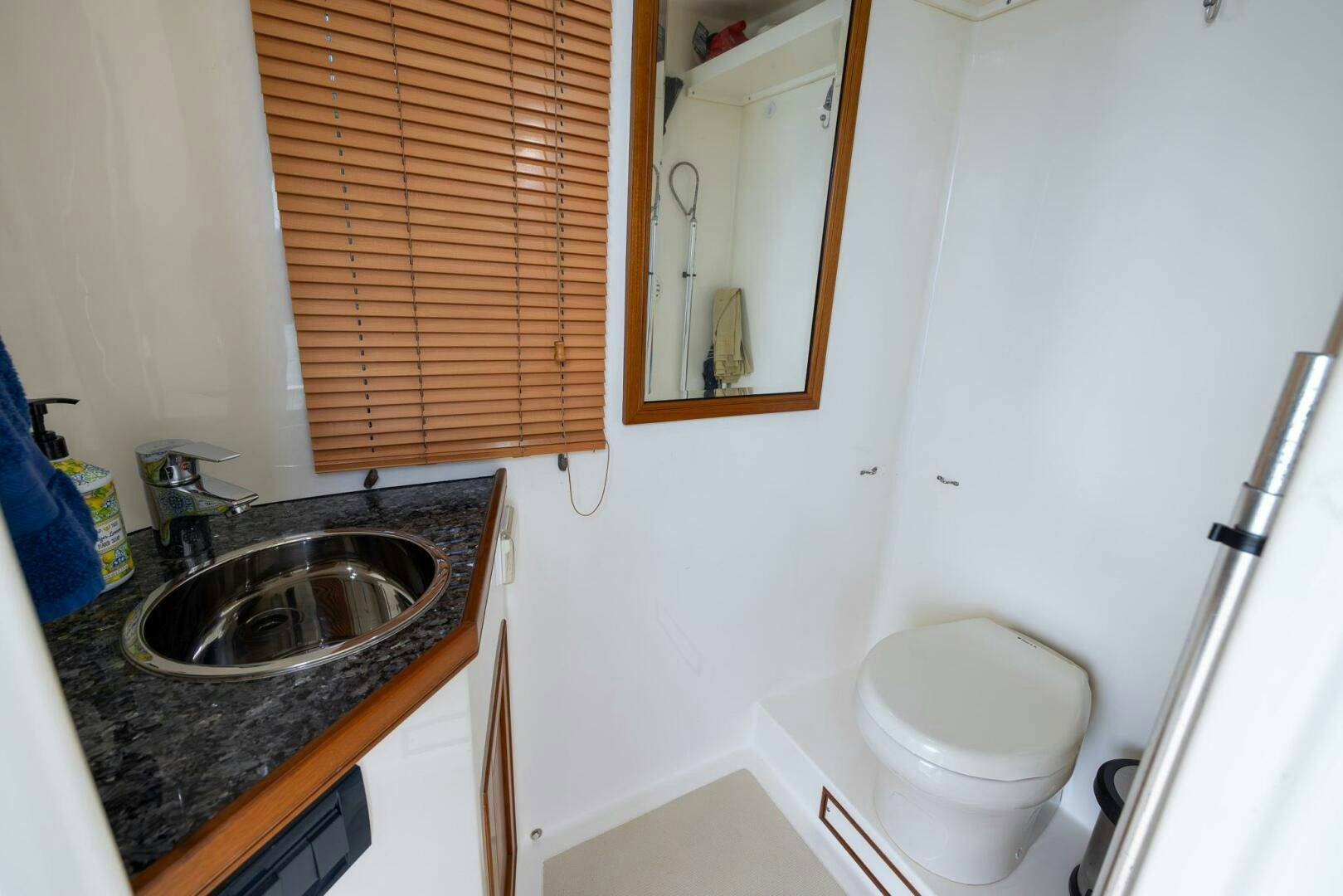 a bathroom with a sink and a toilet aboard INDIGO Yacht for Sale