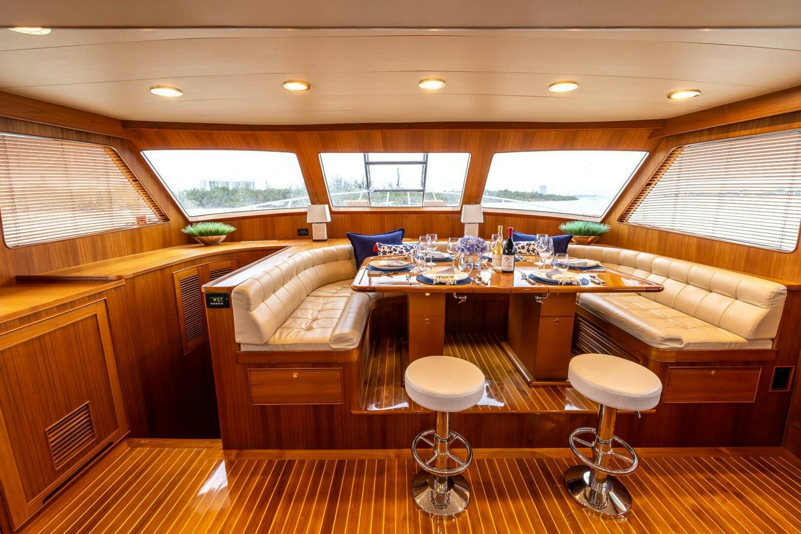 a room with a table and chairs aboard INDIGO Yacht for Sale