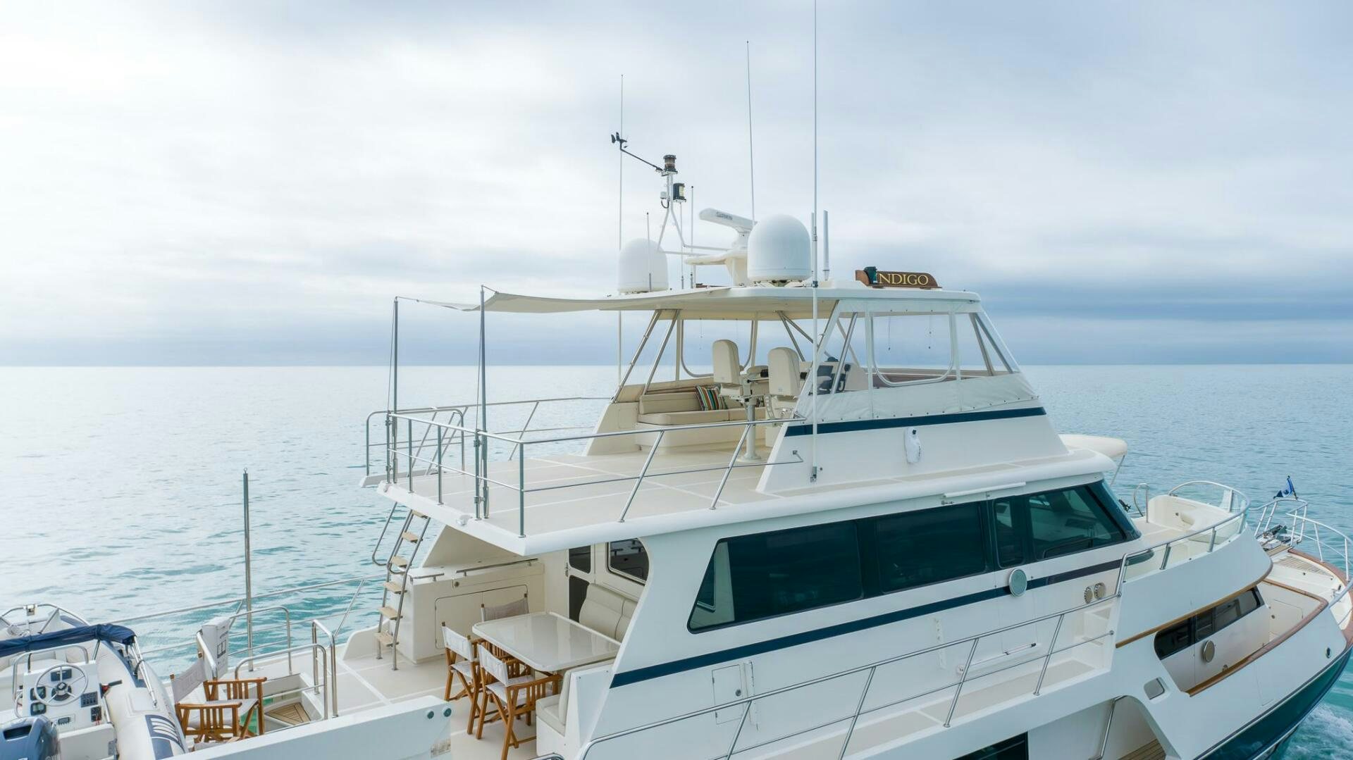 a white yacht in the water aboard INDIGO Yacht for Sale