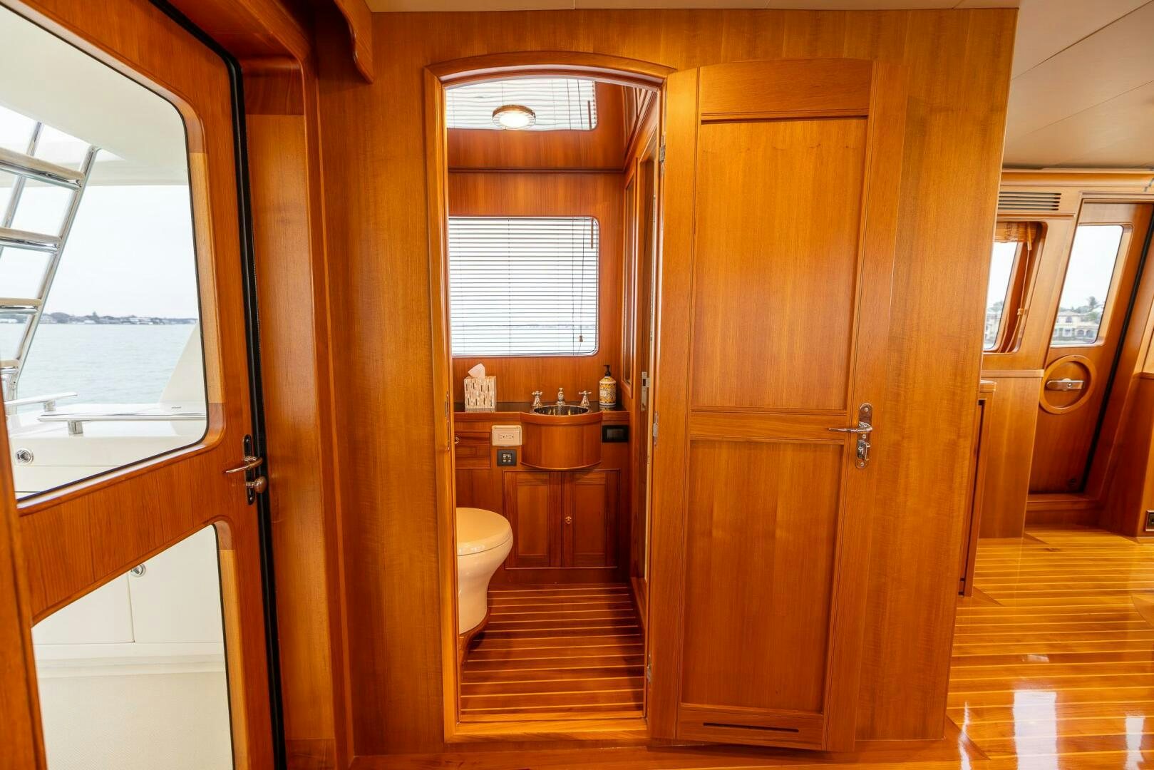 a bathroom with wooden cabinets aboard INDIGO Yacht for Sale