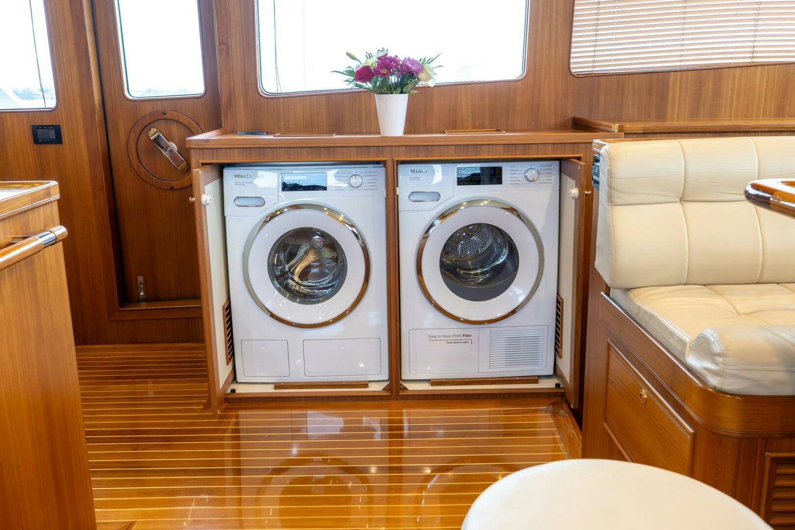 a room with a washer and dryer aboard INDIGO Yacht for Sale