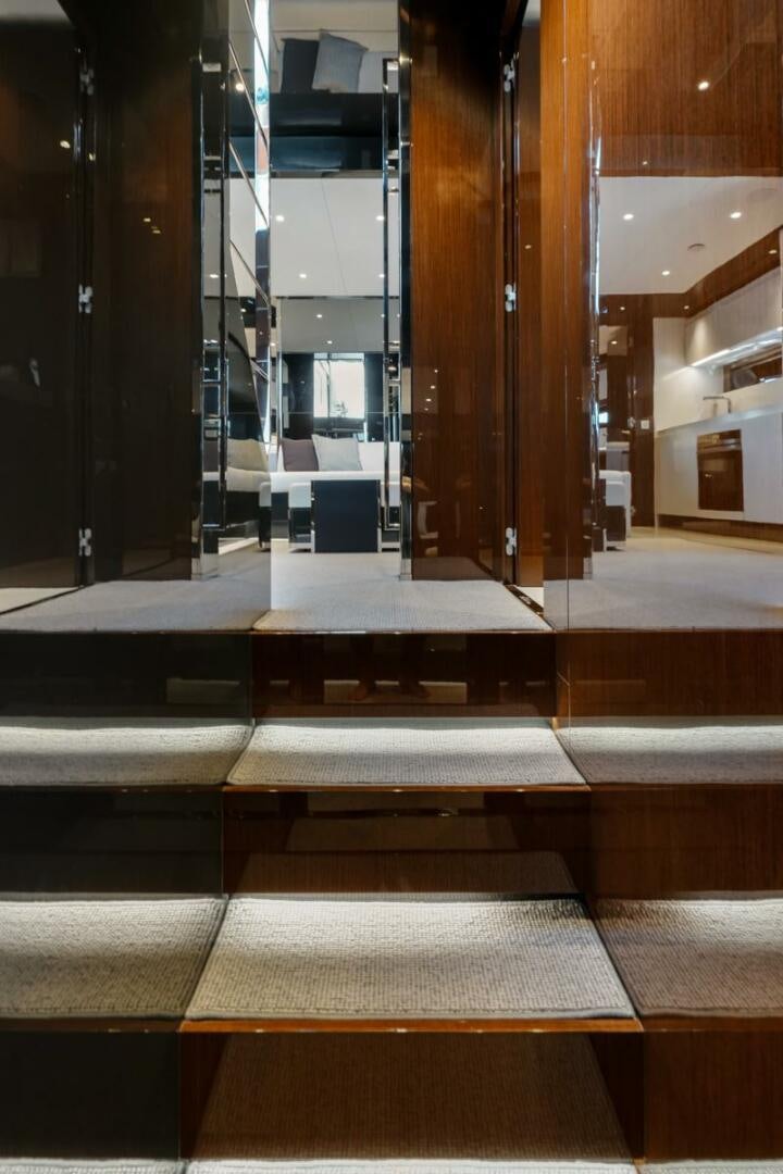 a room with a staircase and a glass door aboard BLUEPRINT Yacht for Sale