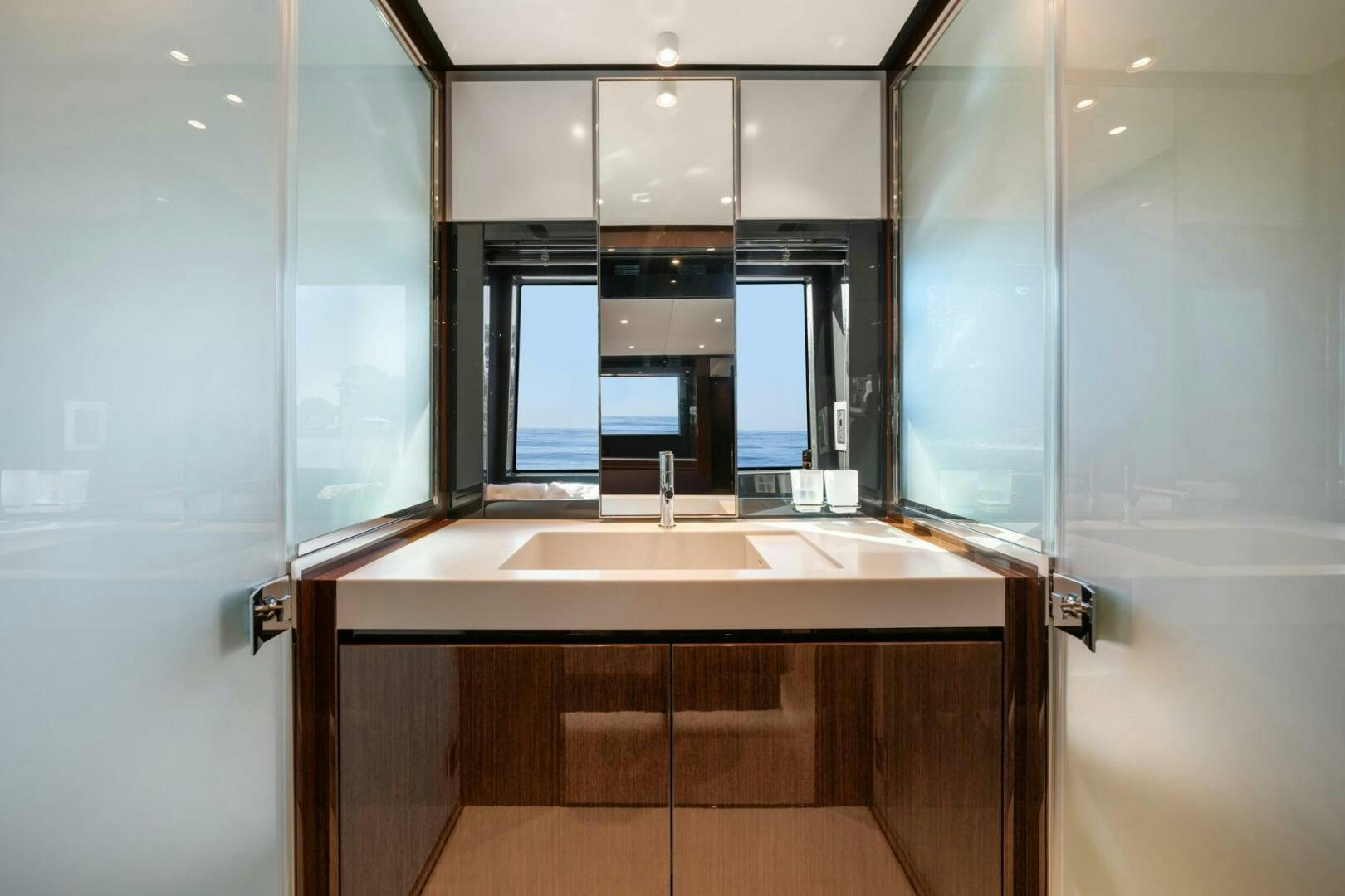 a bathroom with a sink and a mirror aboard BLUEPRINT Yacht for Sale