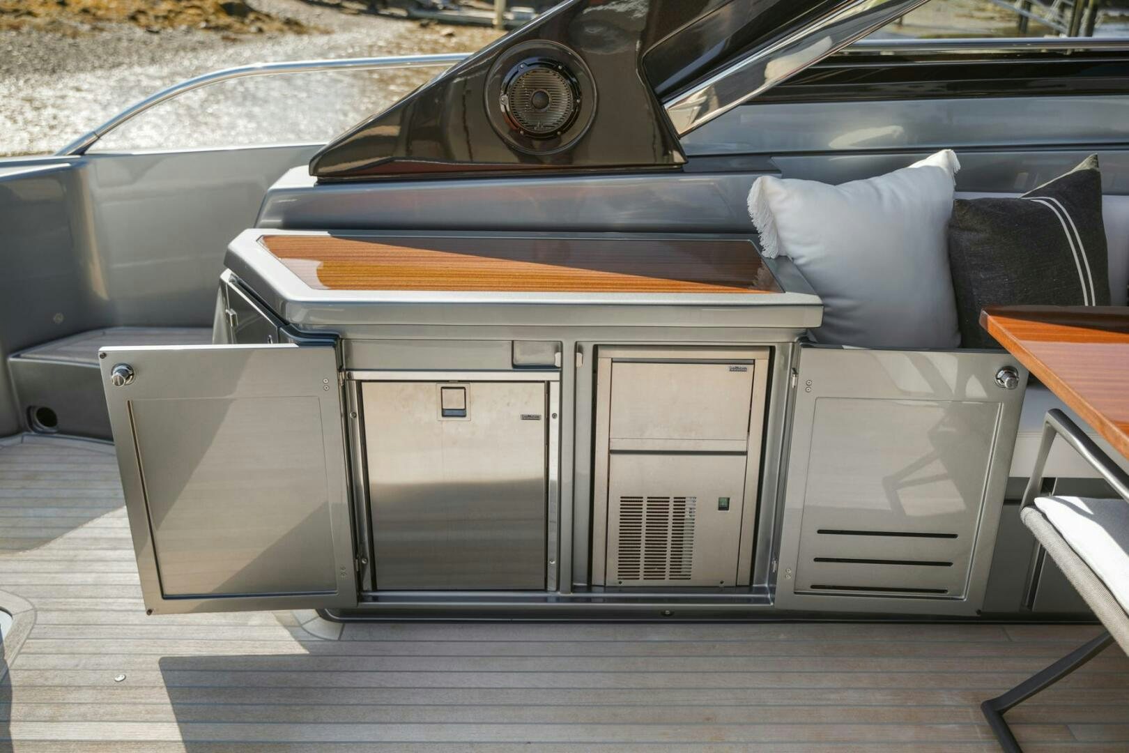 a car with a surfboard on the back aboard BLUEPRINT Yacht for Sale