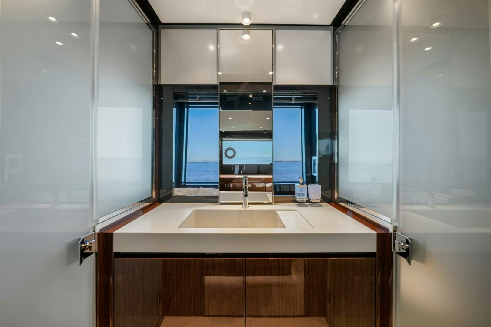 a bathroom with a sink and cabinets aboard BLUEPRINT Yacht for Sale