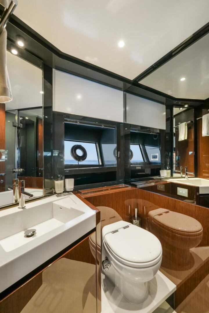 a bathroom with a large mirror aboard BLUEPRINT Yacht for Sale