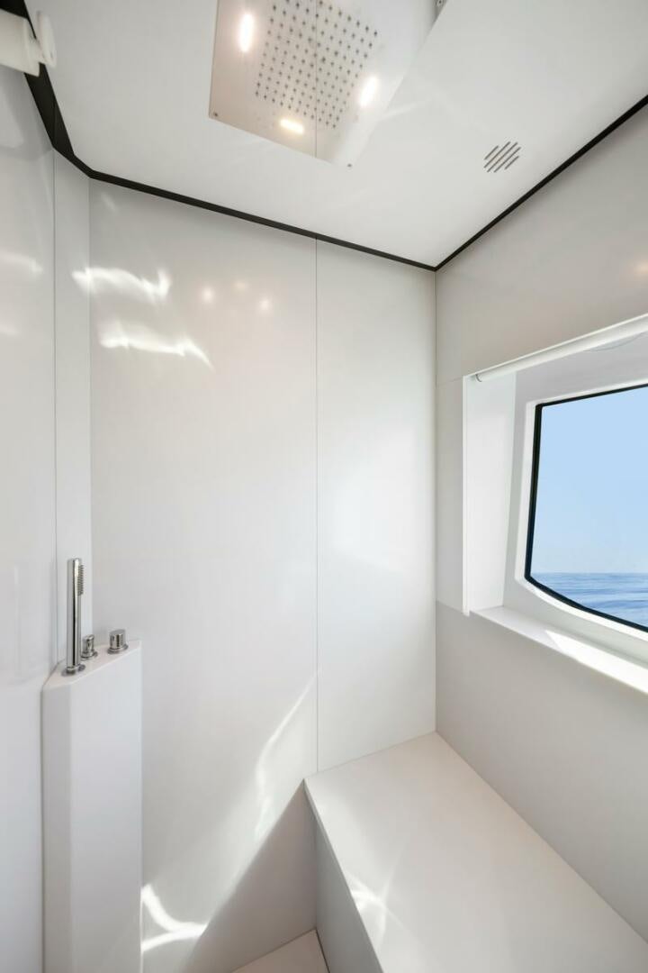 a white wall with a window aboard BLUEPRINT Yacht for Sale
