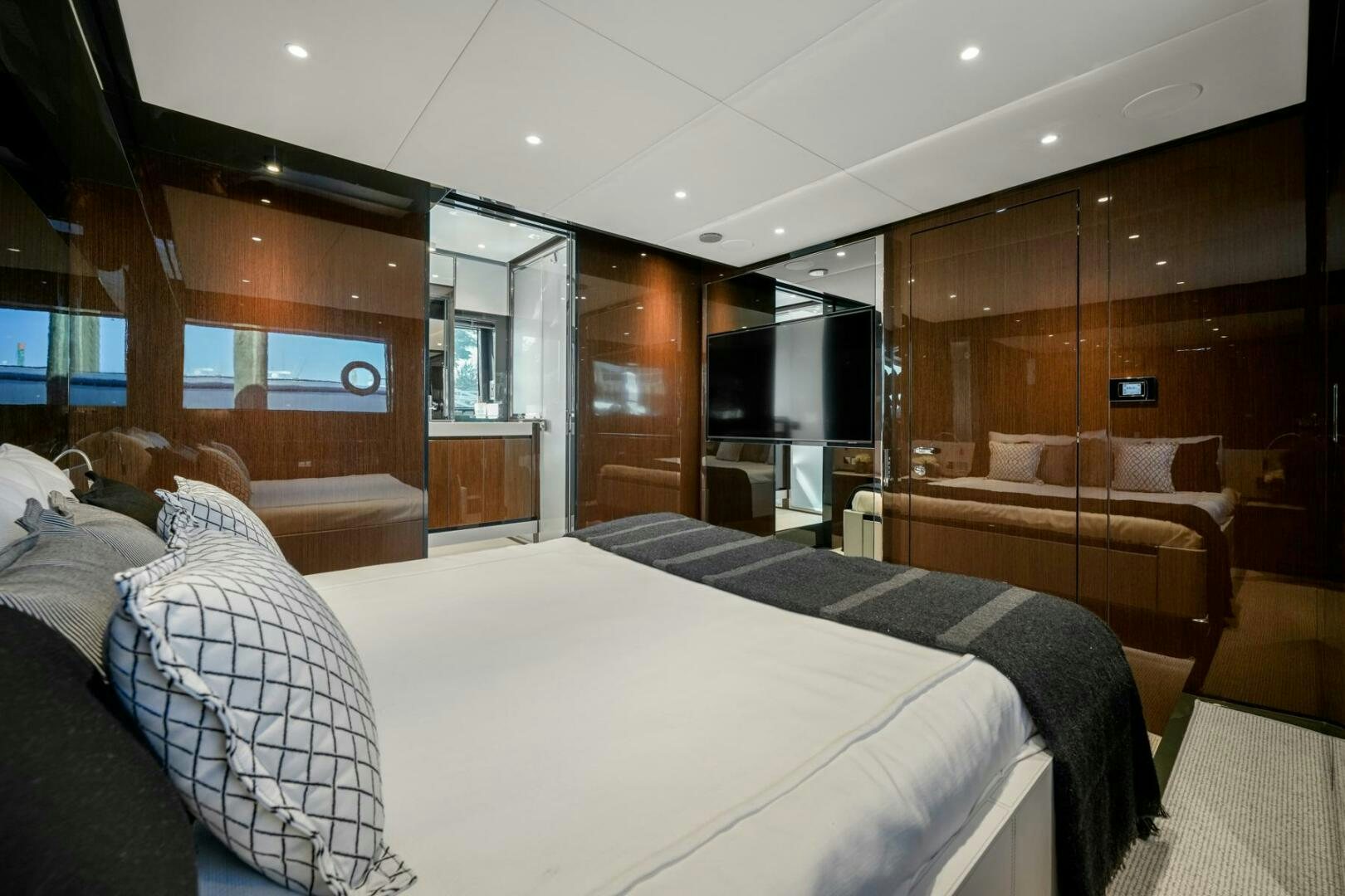 a room with a bed and a couch aboard BLUEPRINT Yacht for Sale