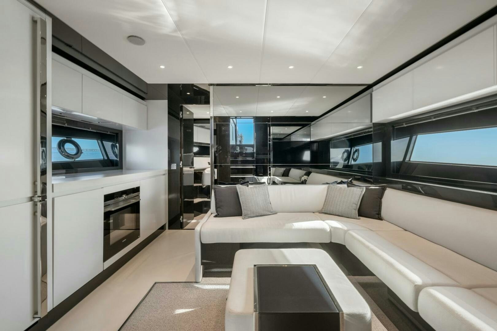 a room with a couch and a tv aboard BLUEPRINT Yacht for Sale