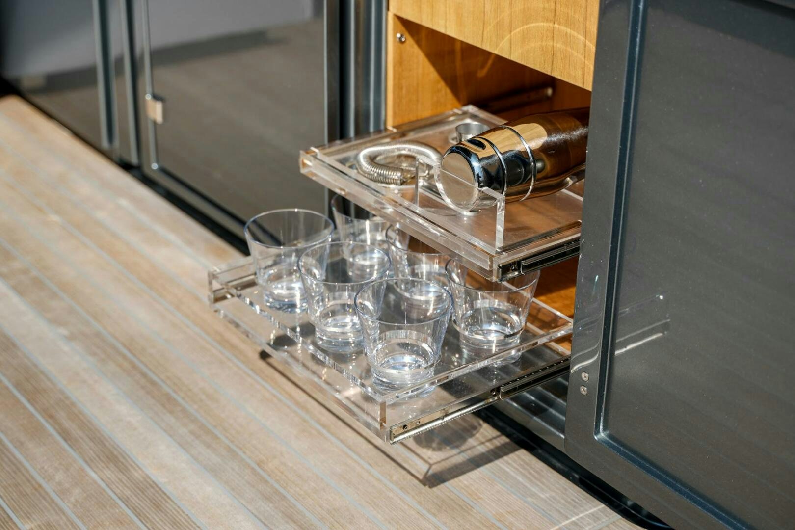 a glass dish with a glass of water and a glass on a table aboard BLUEPRINT Yacht for Sale