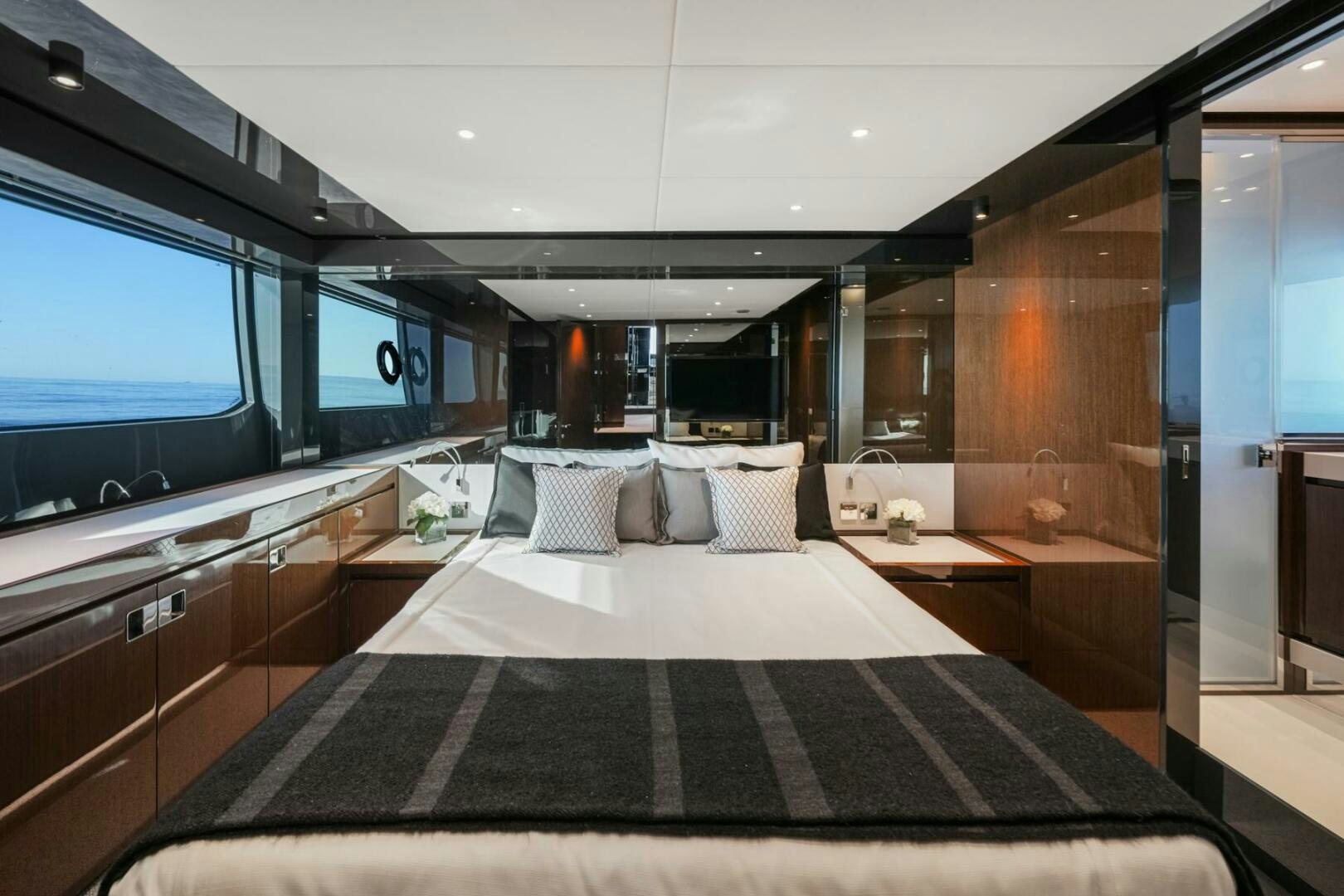 a room with a bed and a tv aboard BLUEPRINT Yacht for Sale