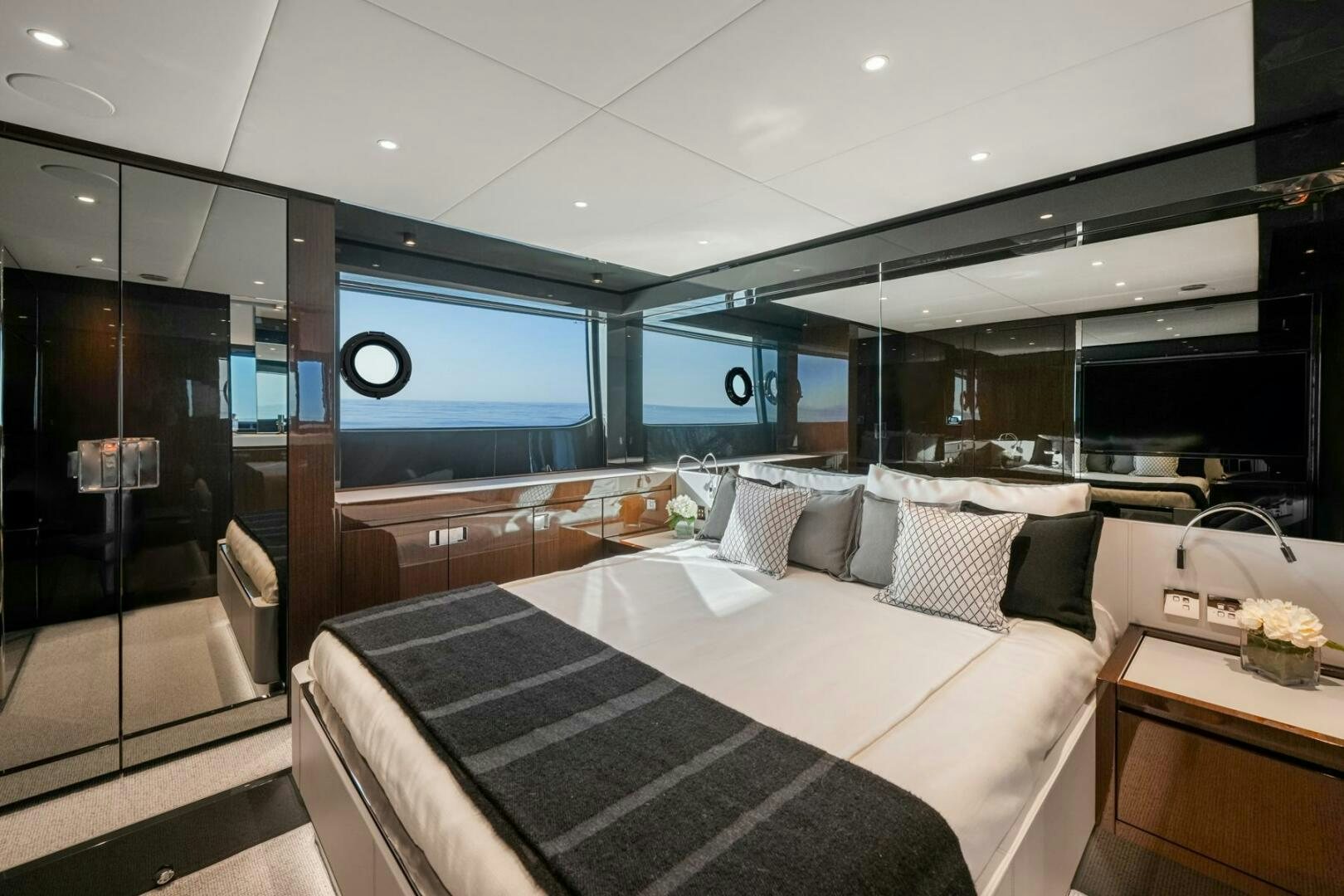 a room with a bed and a tv aboard BLUEPRINT Yacht for Sale
