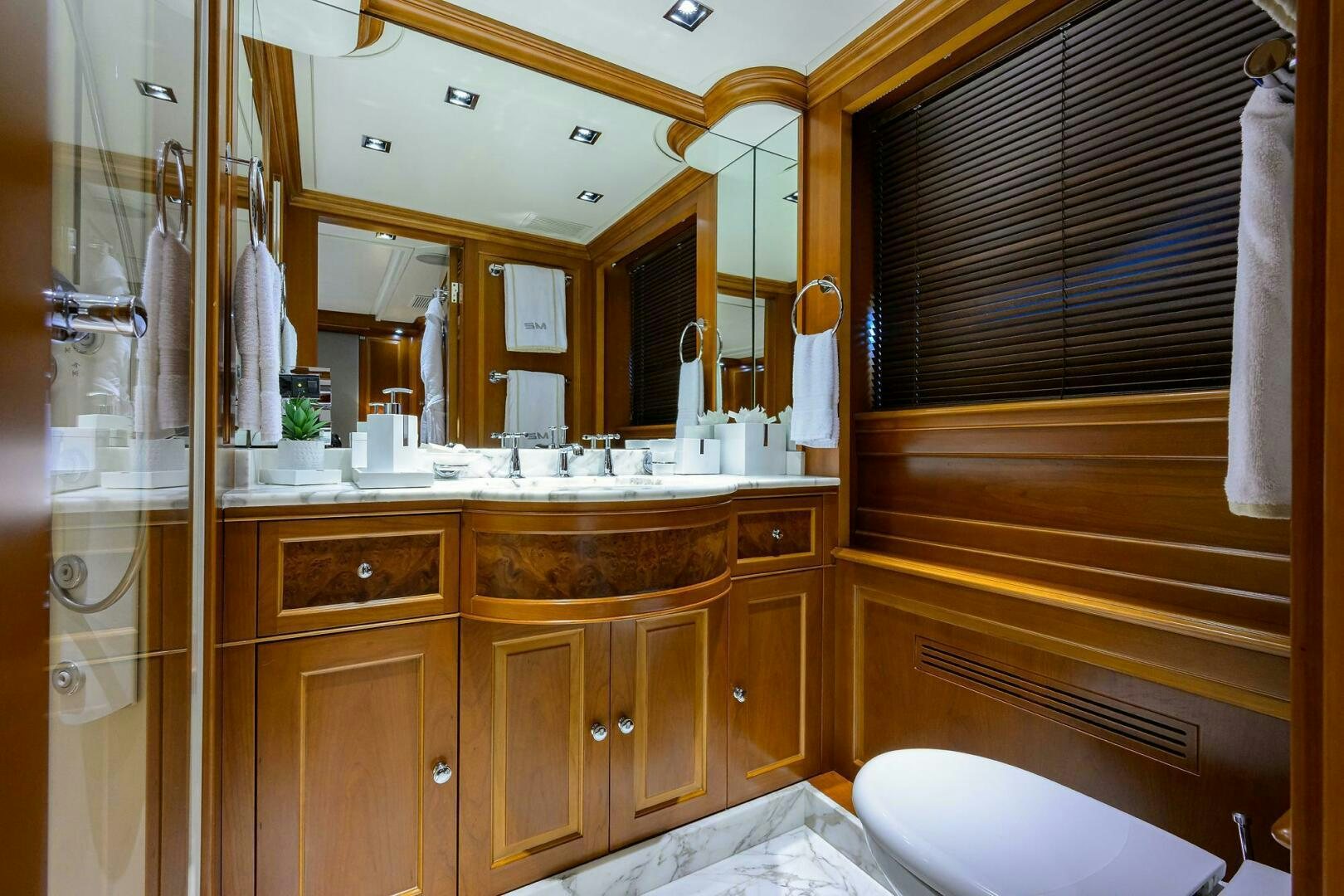 a bathroom with a sink and cabinets aboard ARTHUR’S WAY Yacht for Sale