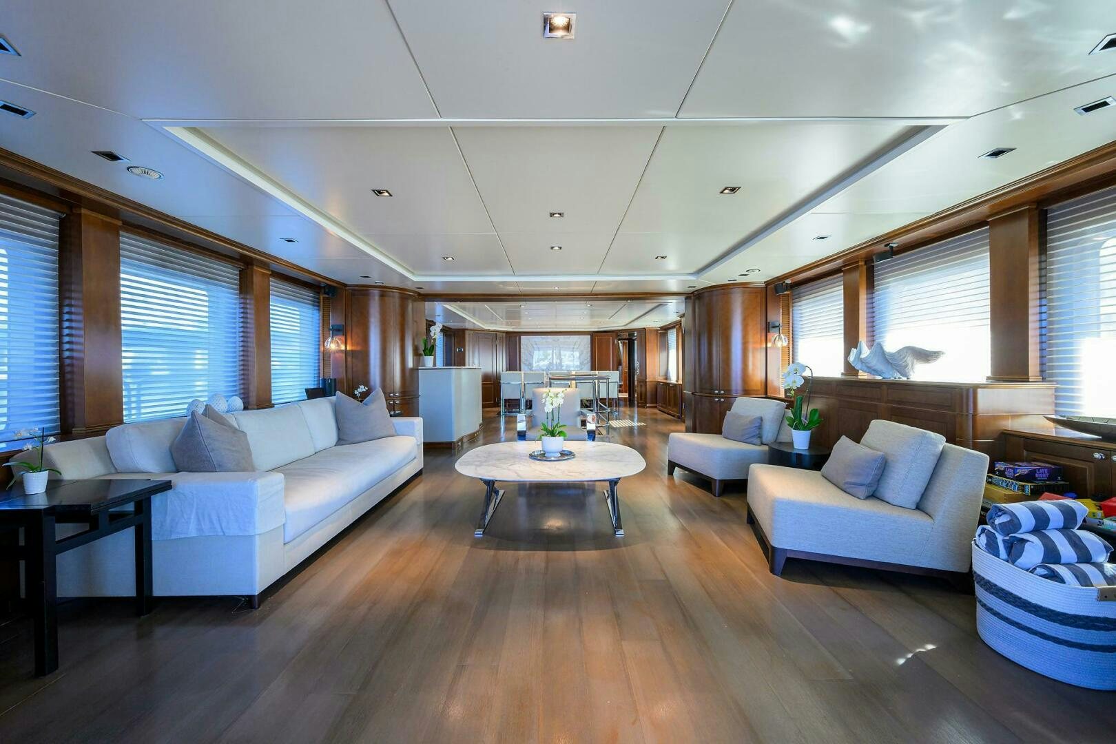 a living room with a wood floor aboard ARTHUR’S WAY Yacht for Sale