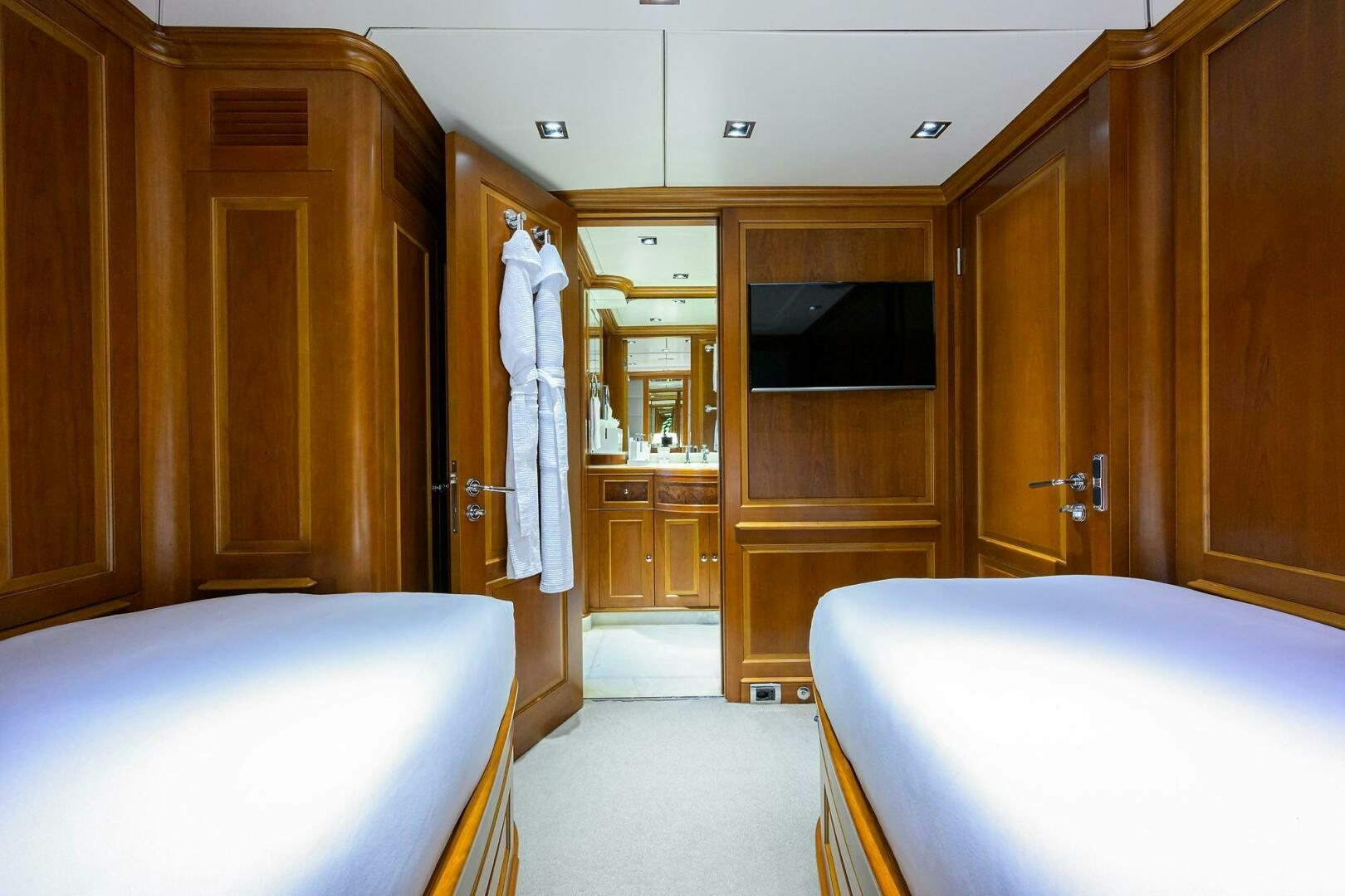 a bedroom with a bed and a closet aboard ARTHUR’S WAY Yacht for Sale