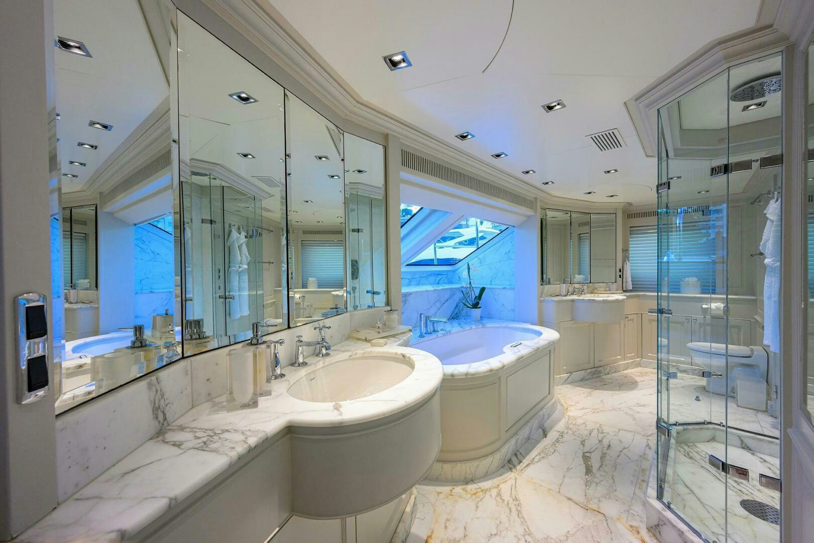 a bathroom with a large mirror aboard ARTHUR’S WAY Yacht for Sale
