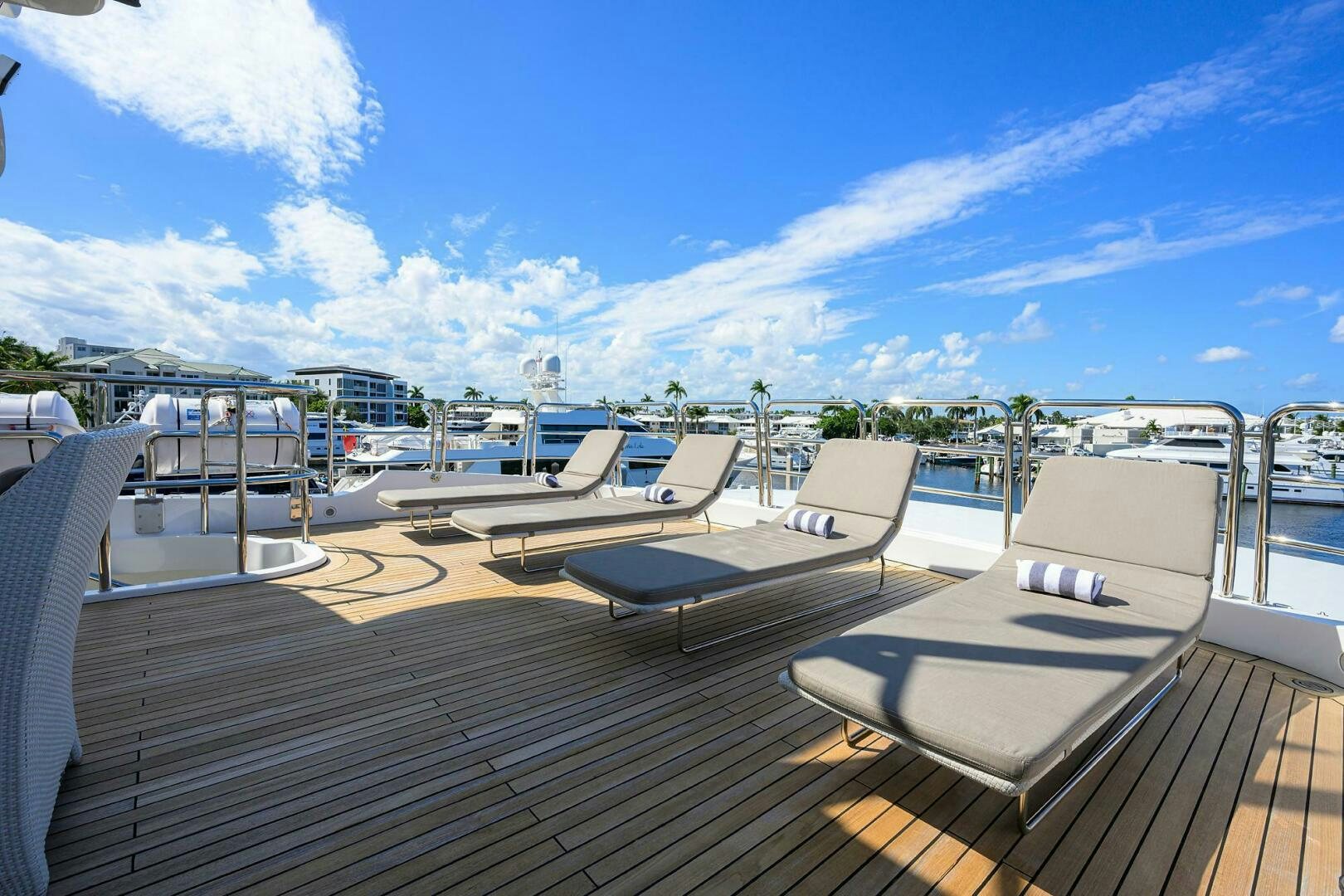 a deck with lounge chairs on it aboard ARTHUR’S WAY Yacht for Sale