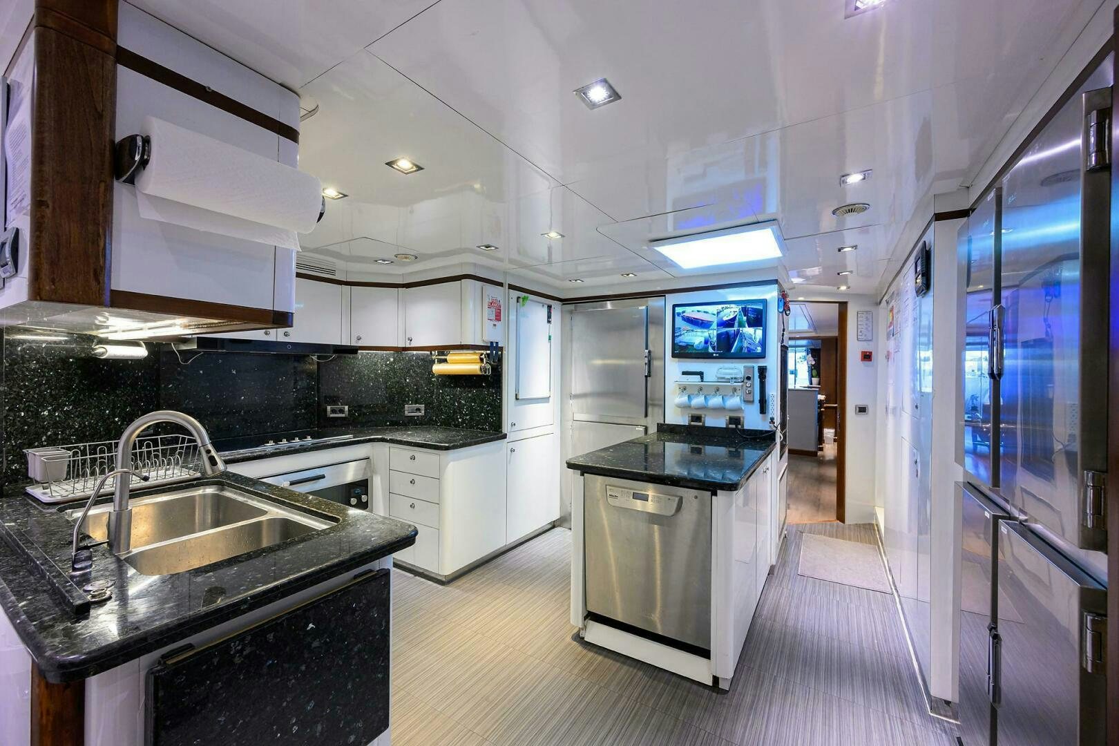 a kitchen with a large island aboard ARTHUR’S WAY Yacht for Sale