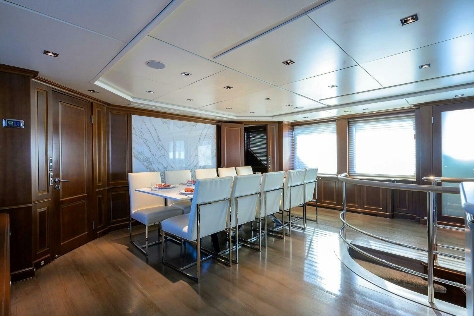 a room with tables and chairs aboard ARTHUR’S WAY Yacht for Sale