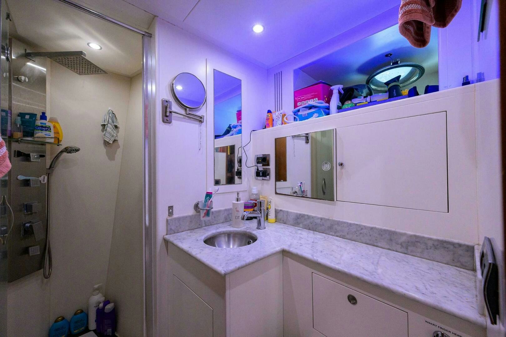 a bathroom with a sink and a mirror aboard ARTHUR’S WAY Yacht for Sale