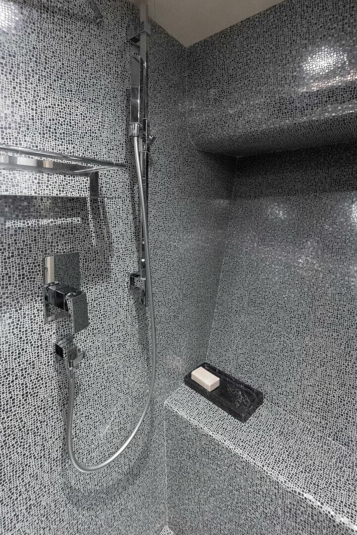a bathroom with a shower aboard PHOENIX RISING Yacht for Sale