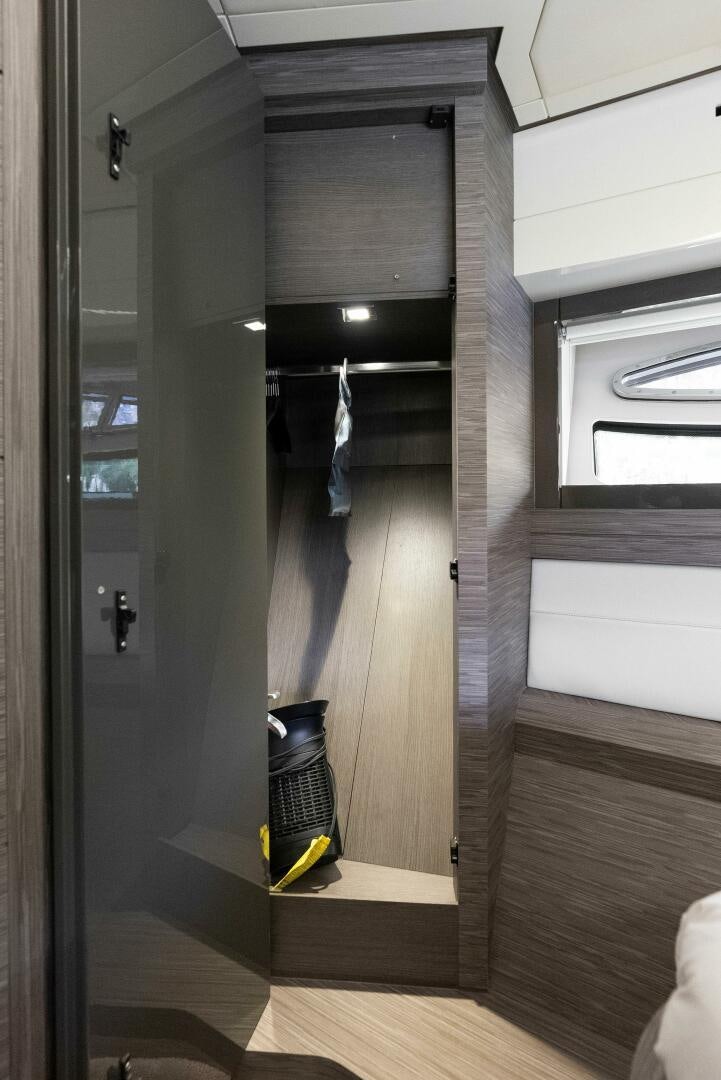a room with a mirror and a door aboard PHOENIX RISING Yacht for Sale