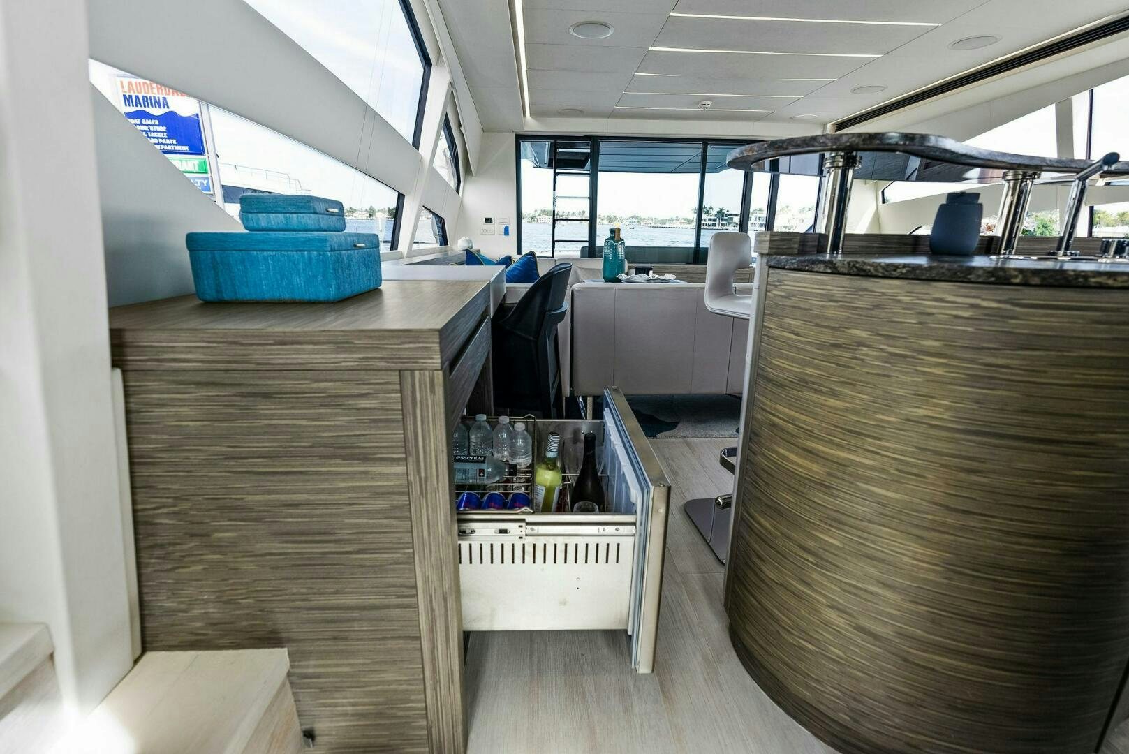a room with tables and chairs aboard PHOENIX RISING Yacht for Sale