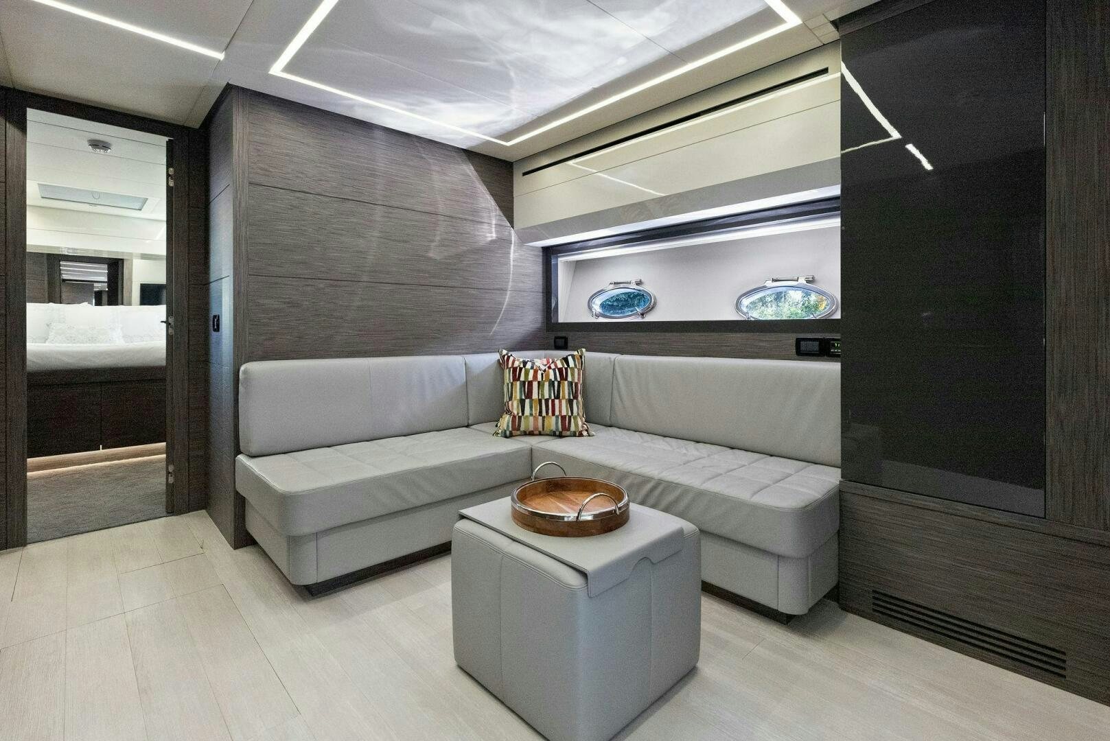 a living room with a couch and a coffee table aboard PHOENIX RISING Yacht for Sale