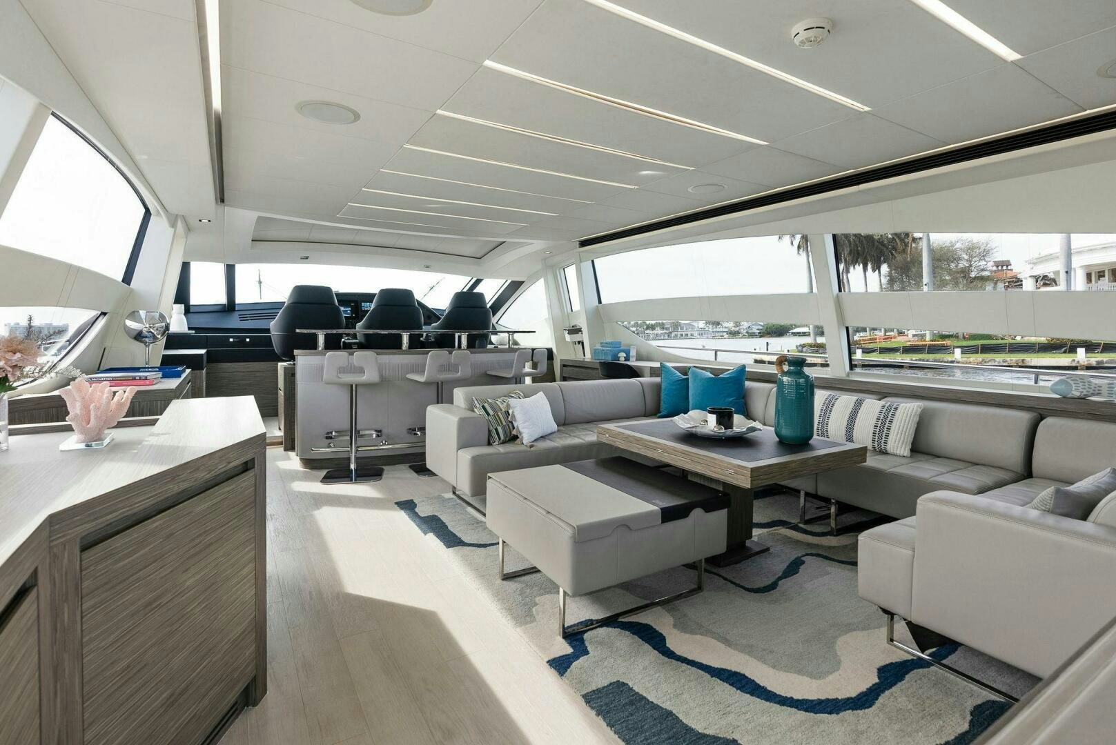 a room with a couch and a table and chairs aboard PHOENIX RISING Yacht for Sale