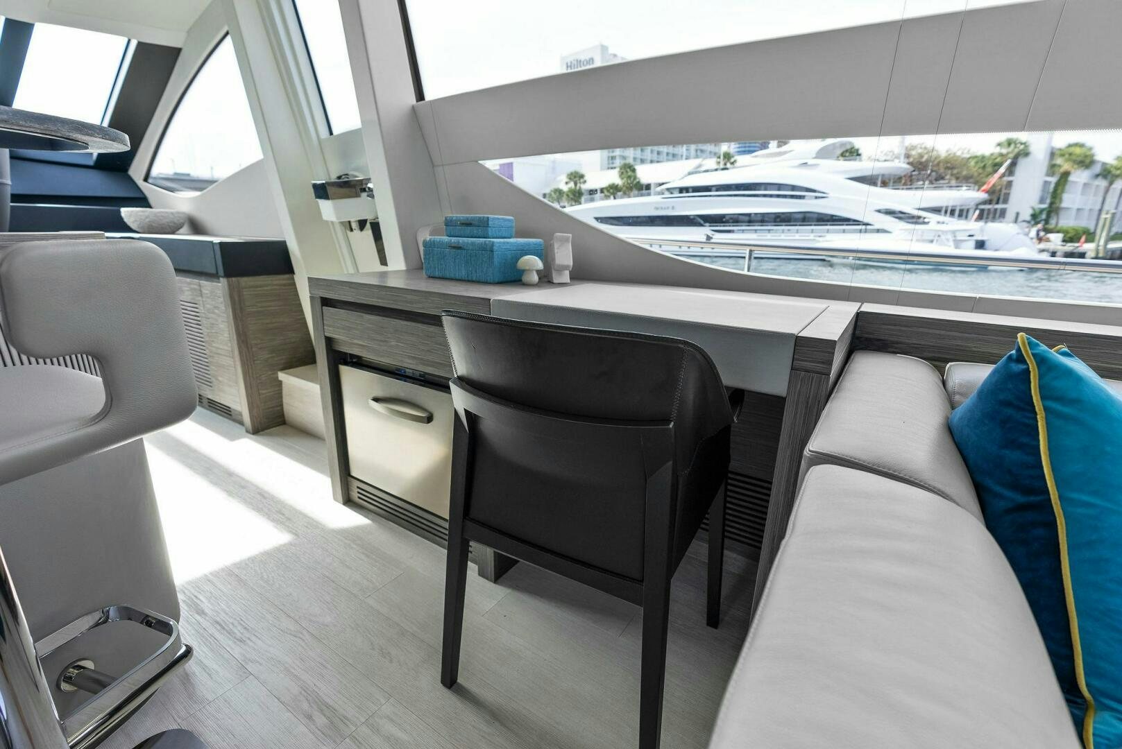 a table with chairs and a desk aboard PHOENIX RISING Yacht for Sale