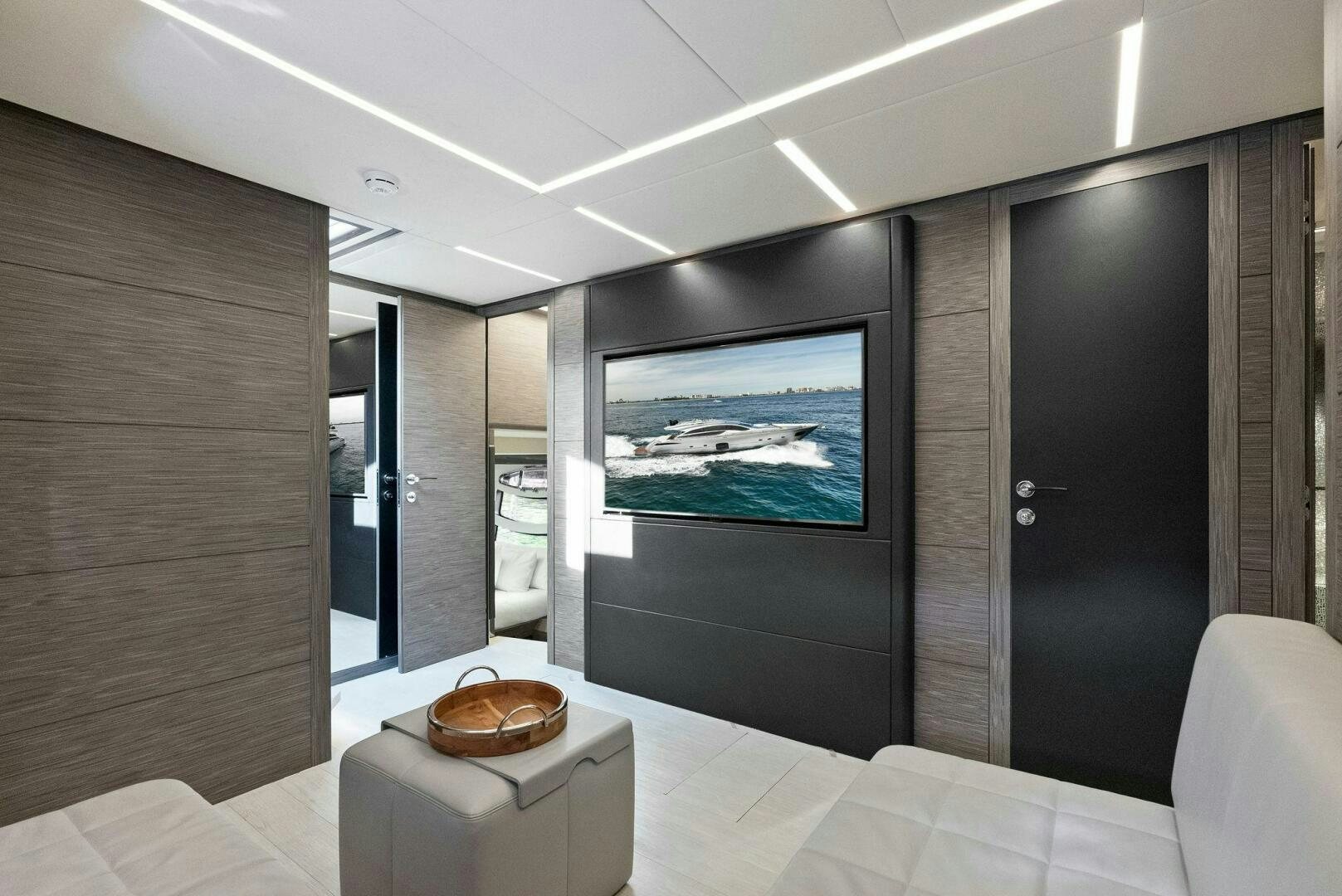 a room with a bed and a television aboard PHOENIX RISING Yacht for Sale