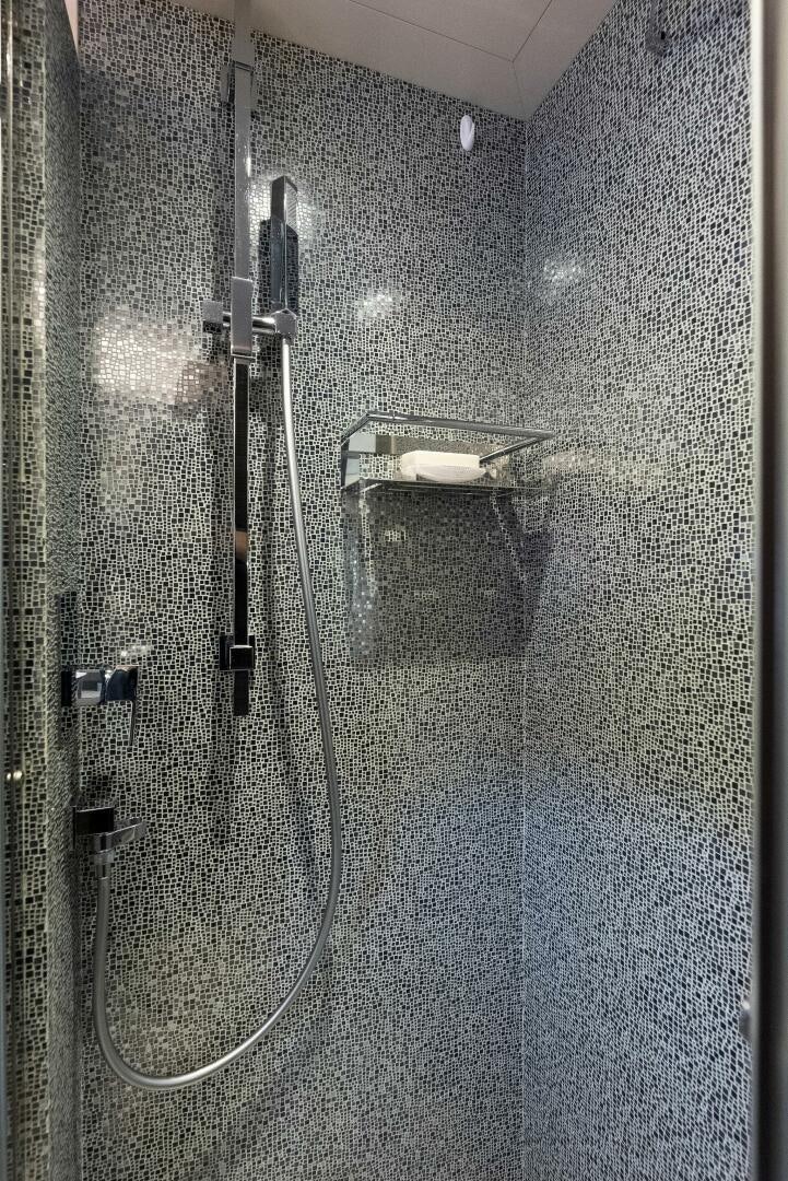 a shower with a metal handle aboard PHOENIX RISING Yacht for Sale
