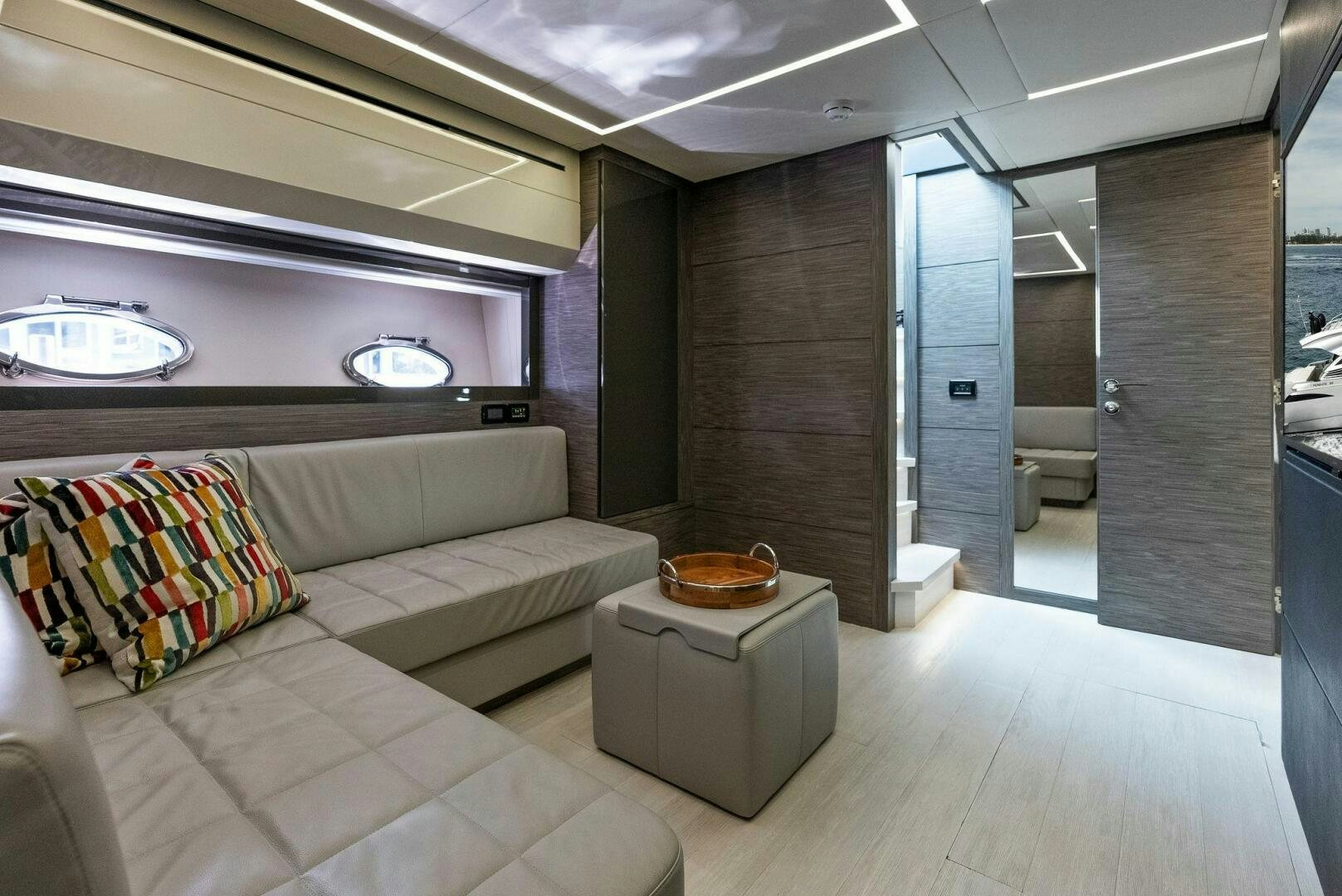 a room with a couch and a table aboard PHOENIX RISING Yacht for Sale