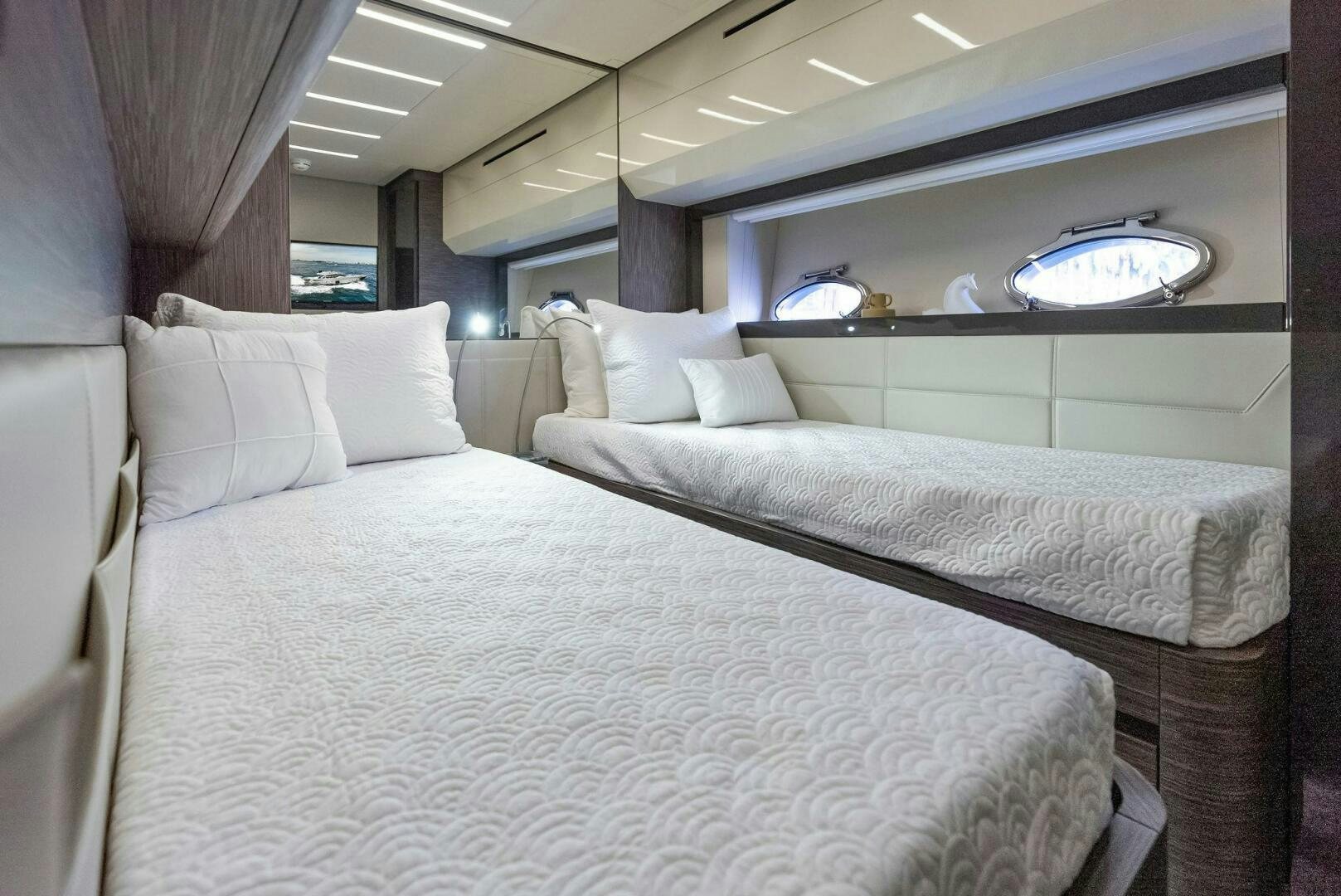 a room with two beds aboard PHOENIX RISING Yacht for Sale