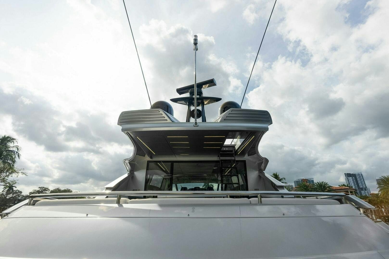 a white boat with a white sail on it aboard PHOENIX RISING Yacht for Sale