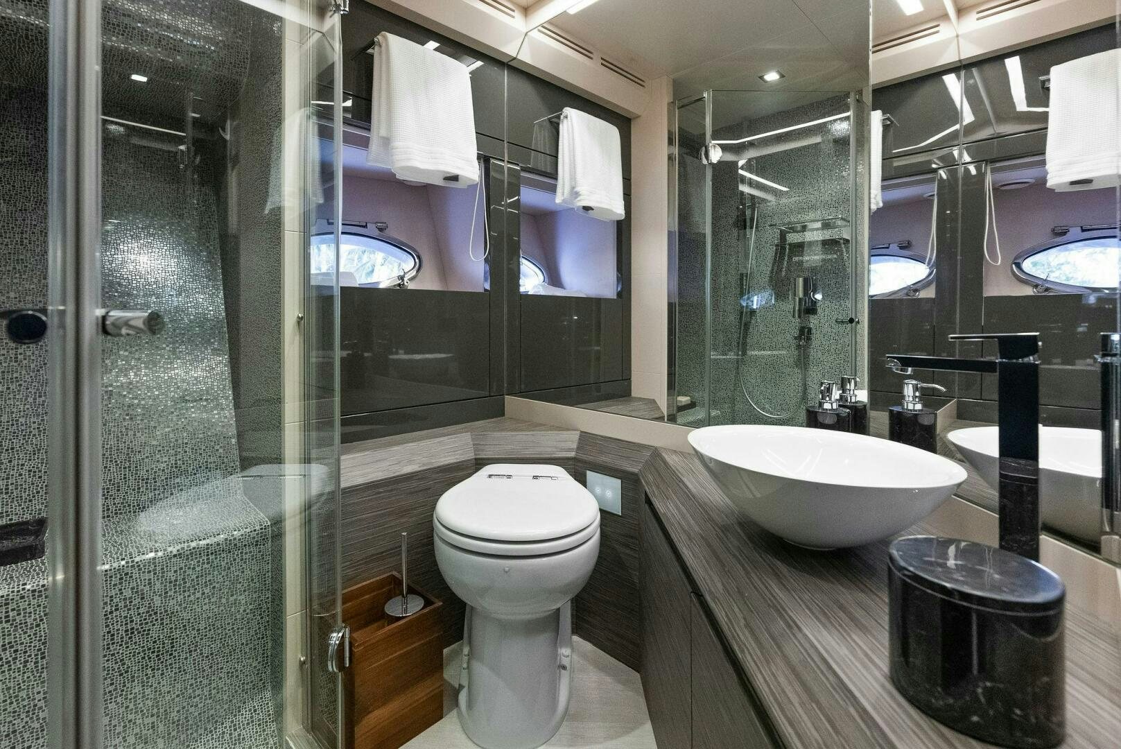 a bathroom with a glass shower aboard PHOENIX RISING Yacht for Sale