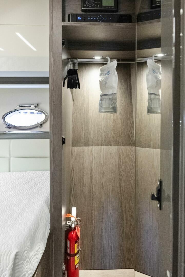 a shower with a light on the door aboard PHOENIX RISING Yacht for Sale